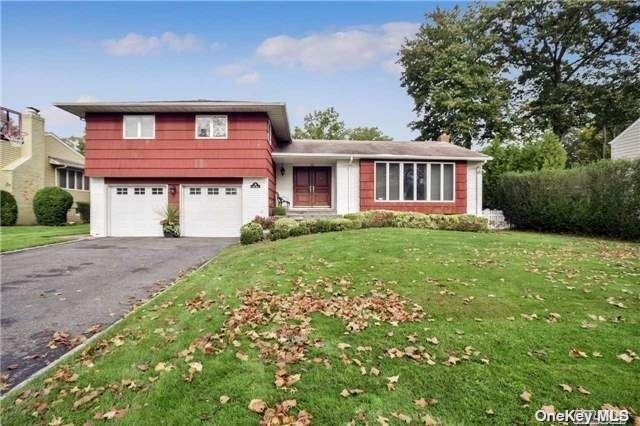 20 Ridge Road Searingtown, NY 11507 - Photo 1 of 1 a front view of a house with garden