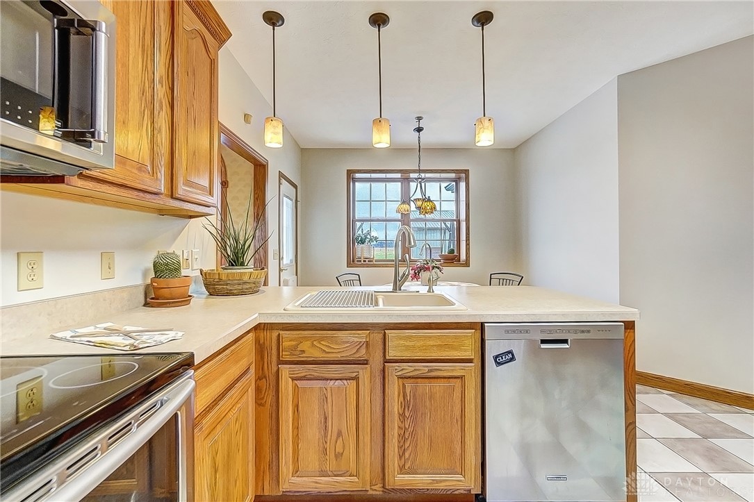 1540 Jasper Road Xenia, OH 45385 - Photo 20 of 91 This spacious kitchen offers ample cabinetry, modern appliances, and abundant natural light.