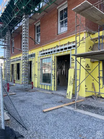 a view of a swimming pool with a outdoor seating