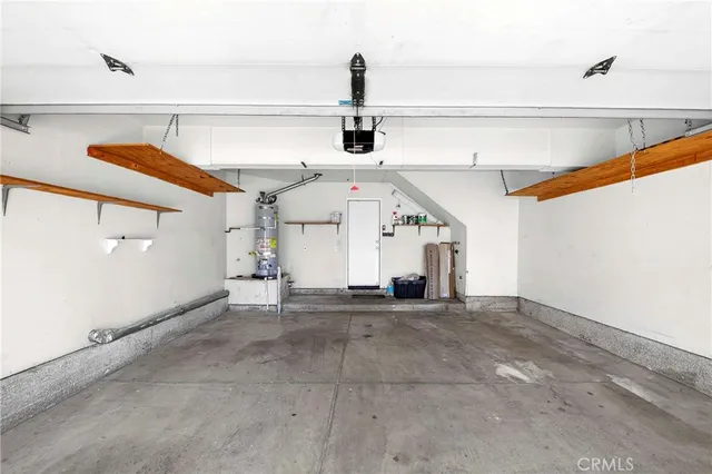 a view of a swimming pool with a table and chairs