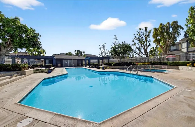 a view of a swimming pool with a patio