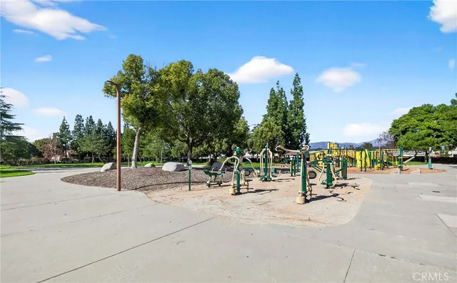a view of a park with trees and flowers