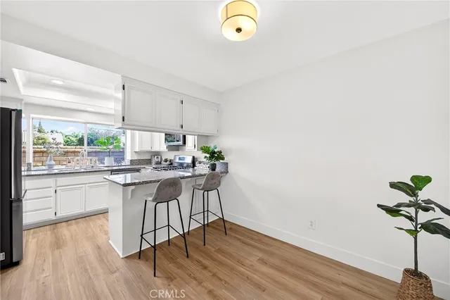 a kitchen with a table and chairs in it