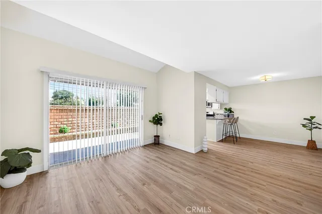 a view of a livingroom with wooden floor