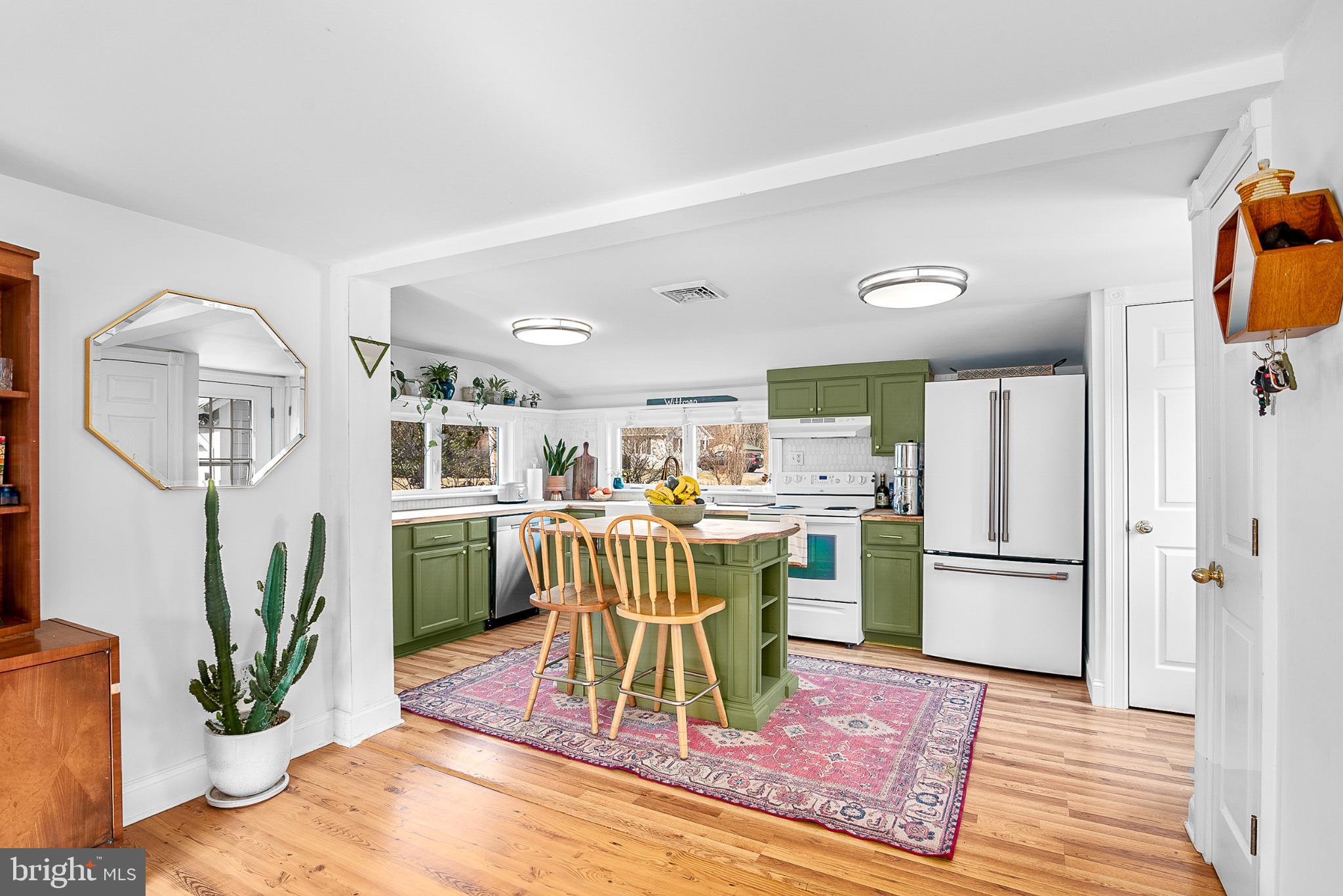22582 Pot Pie Road Wittman, MD 21676 - Photo 15 of 36 a living room with furniture a fireplace and a potted plant