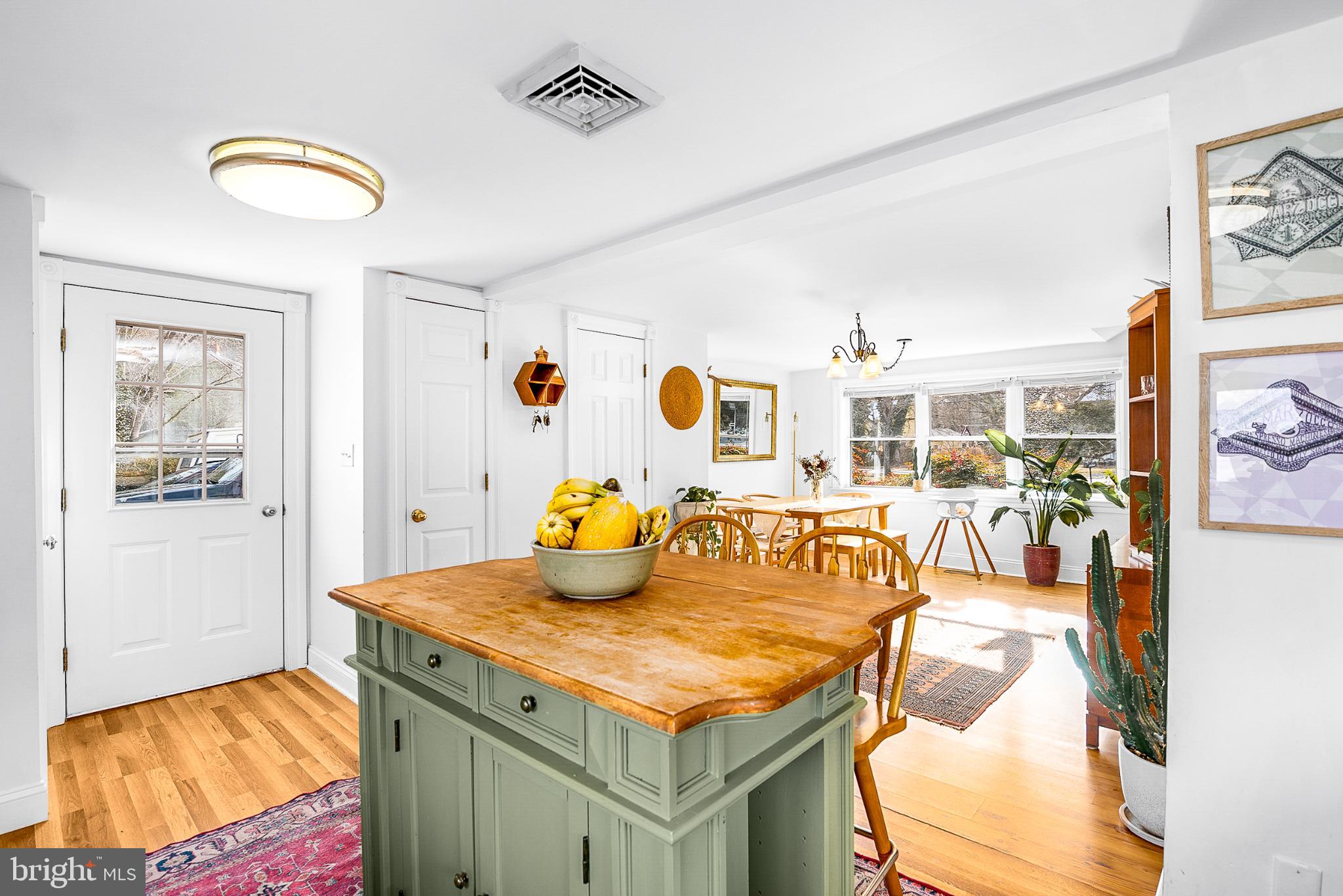 22582 Pot Pie Road Wittman, MD 21676 - Photo 18 of 36 a bedroom with a bed and a chandelier