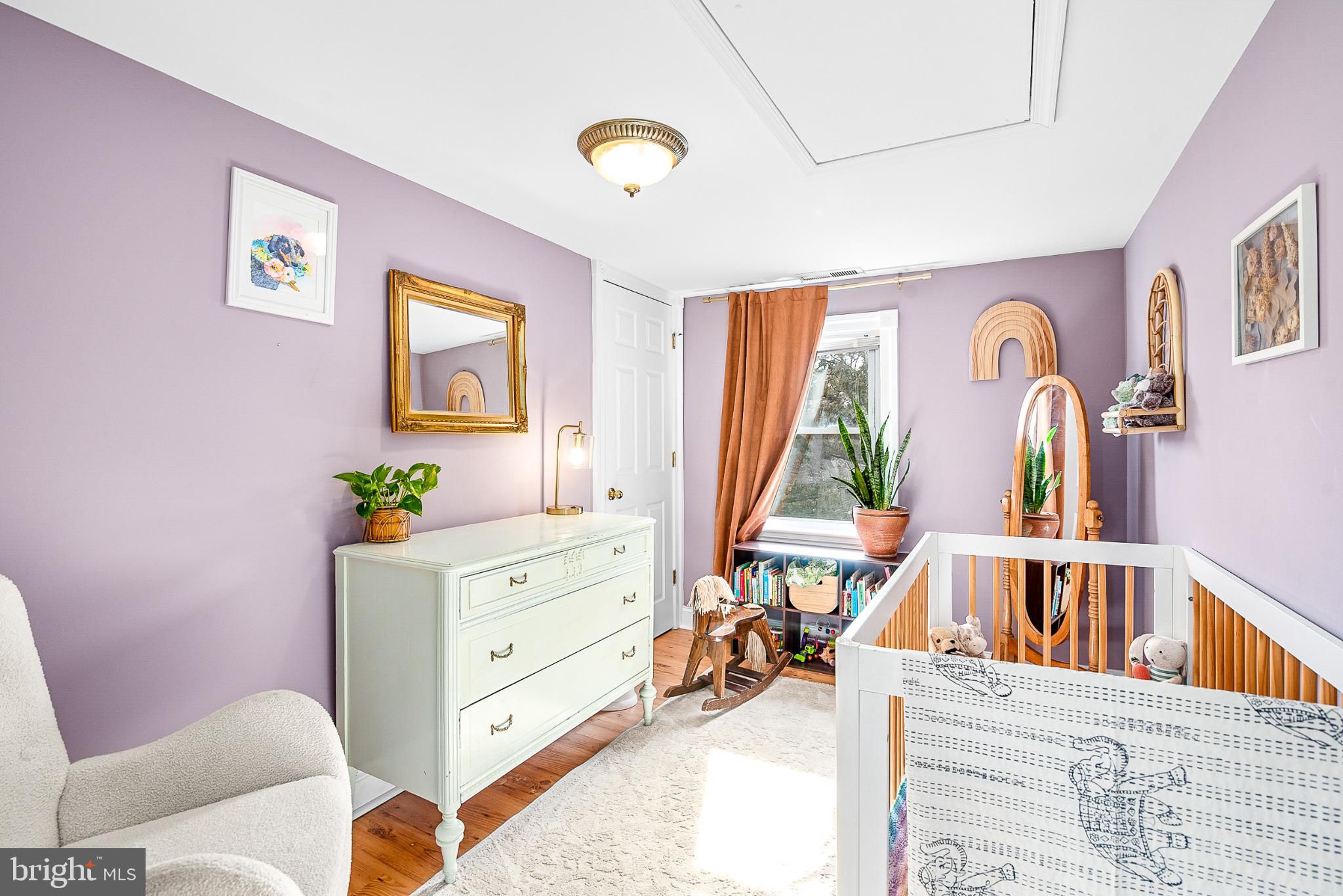 22582 Pot Pie Road Wittman, MD 21676 - Photo 22 of 36 a living room with furniture and a baby crib
