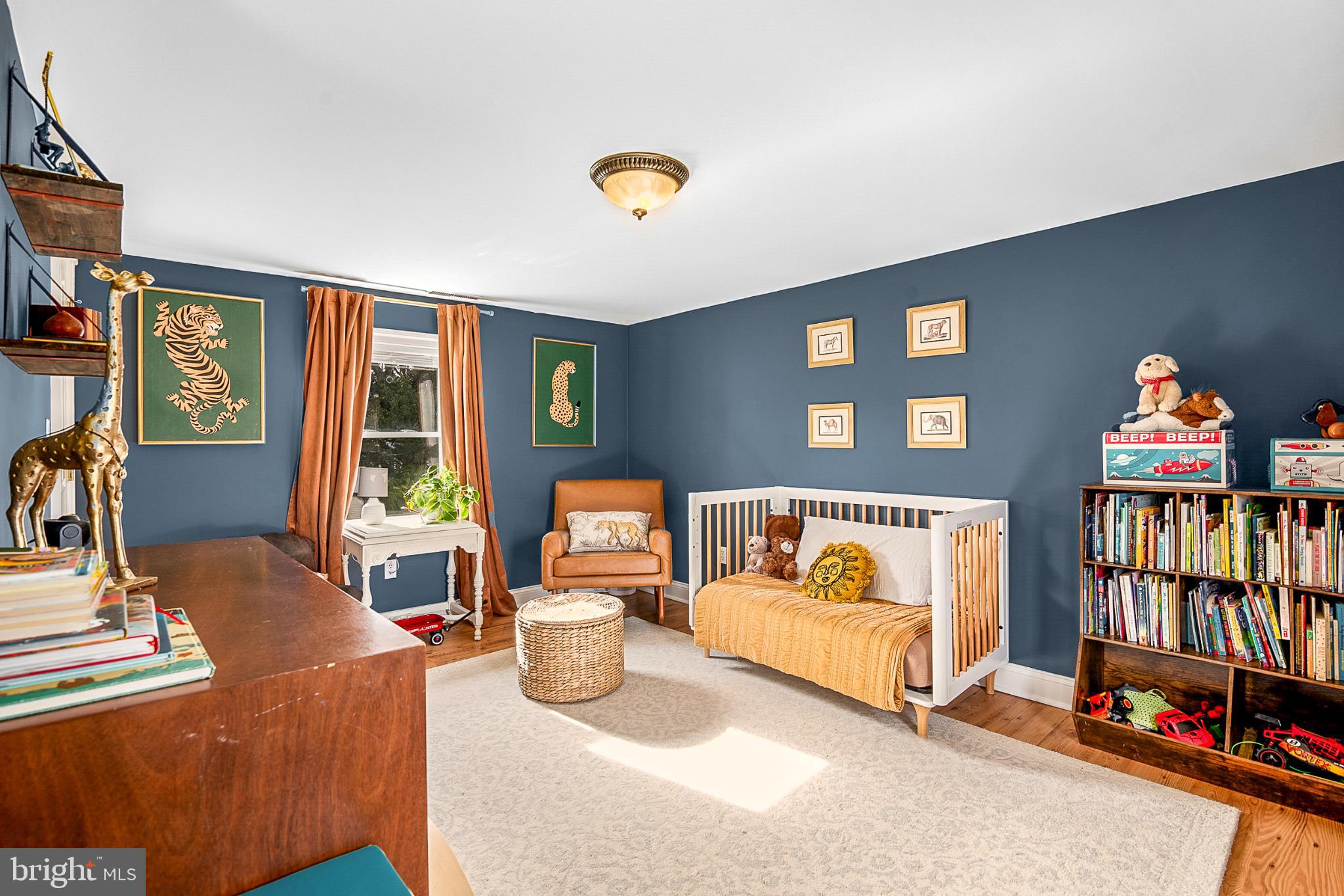 22582 Pot Pie Road Wittman, MD 21676 - Photo 24 of 36 a bedroom with furniture and a book shelf