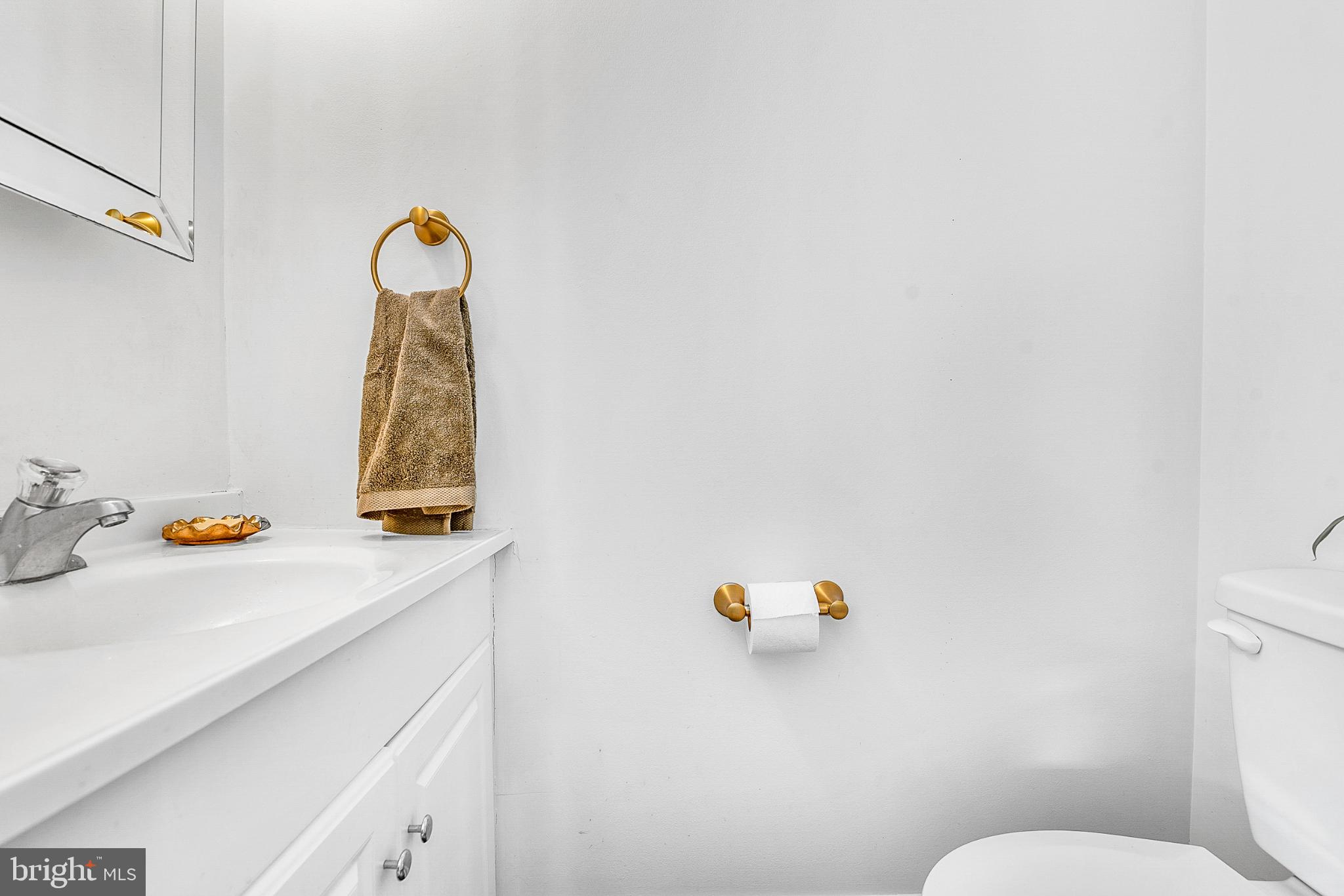 22582 Pot Pie Road Wittman, MD 21676 - Photo 27 of 36 a bathroom with a sink and a toilet