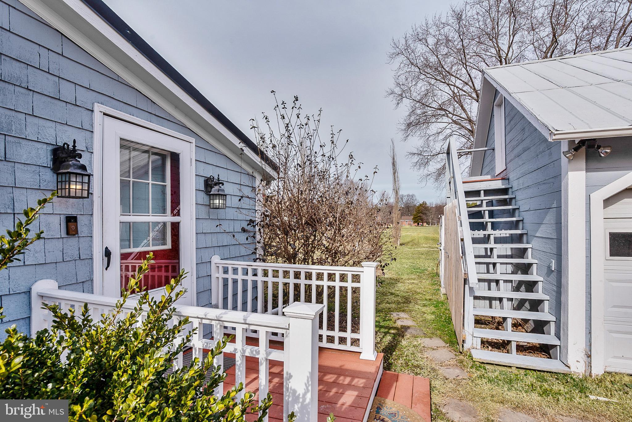 22582 Pot Pie Road Wittman, MD 21676 - Photo 29 of 36 front view of a house with large windows