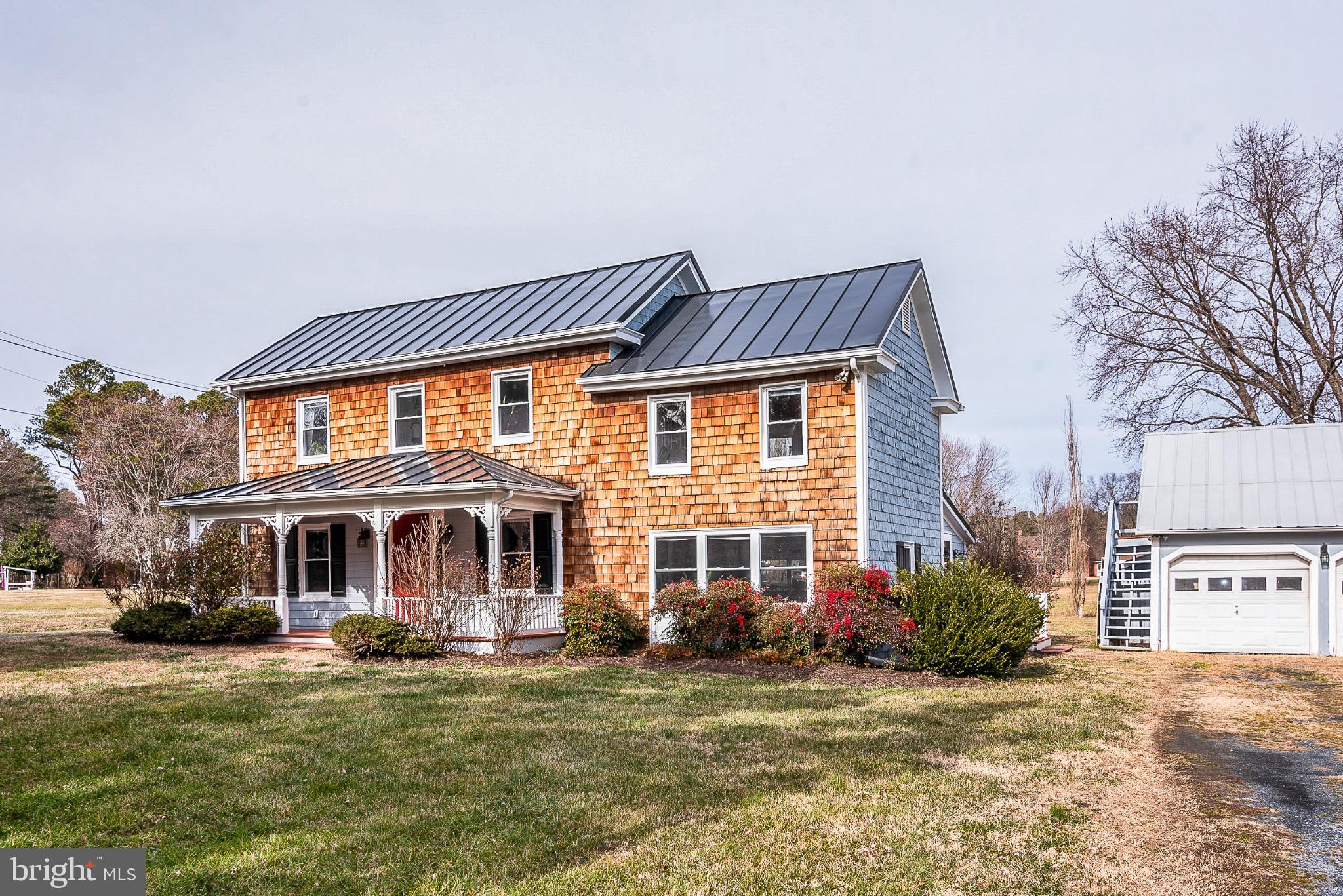22582 Pot Pie Road Wittman, MD 21676 - Photo 36 of 36 a front view of a house with a garden