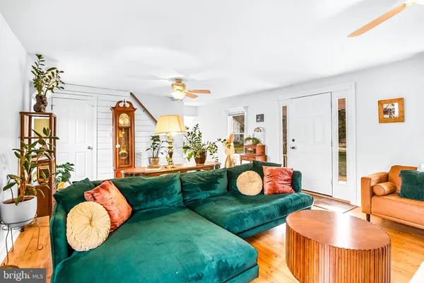a living room with window and furniture