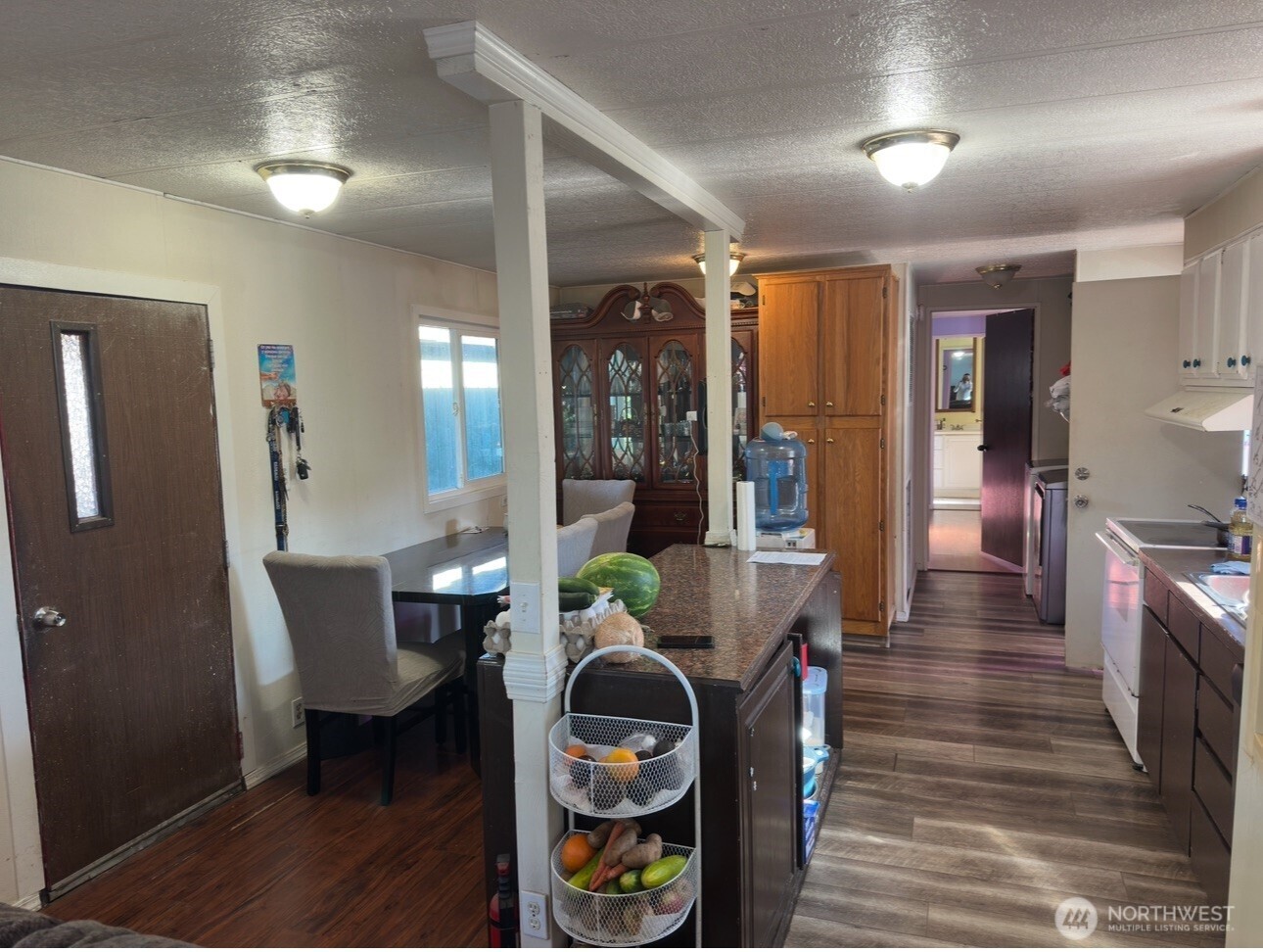 205 Reeds Lane, Unit 64 Everson, WA 98247 - Photo 2 of 9 a dining room with furniture and wooden floor