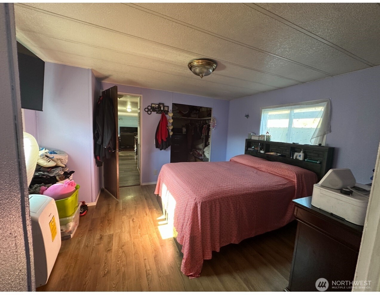 205 Reeds Lane, Unit 64 Everson, WA 98247 - Photo 3 of 9 a bed room with a bed and a walk in closet