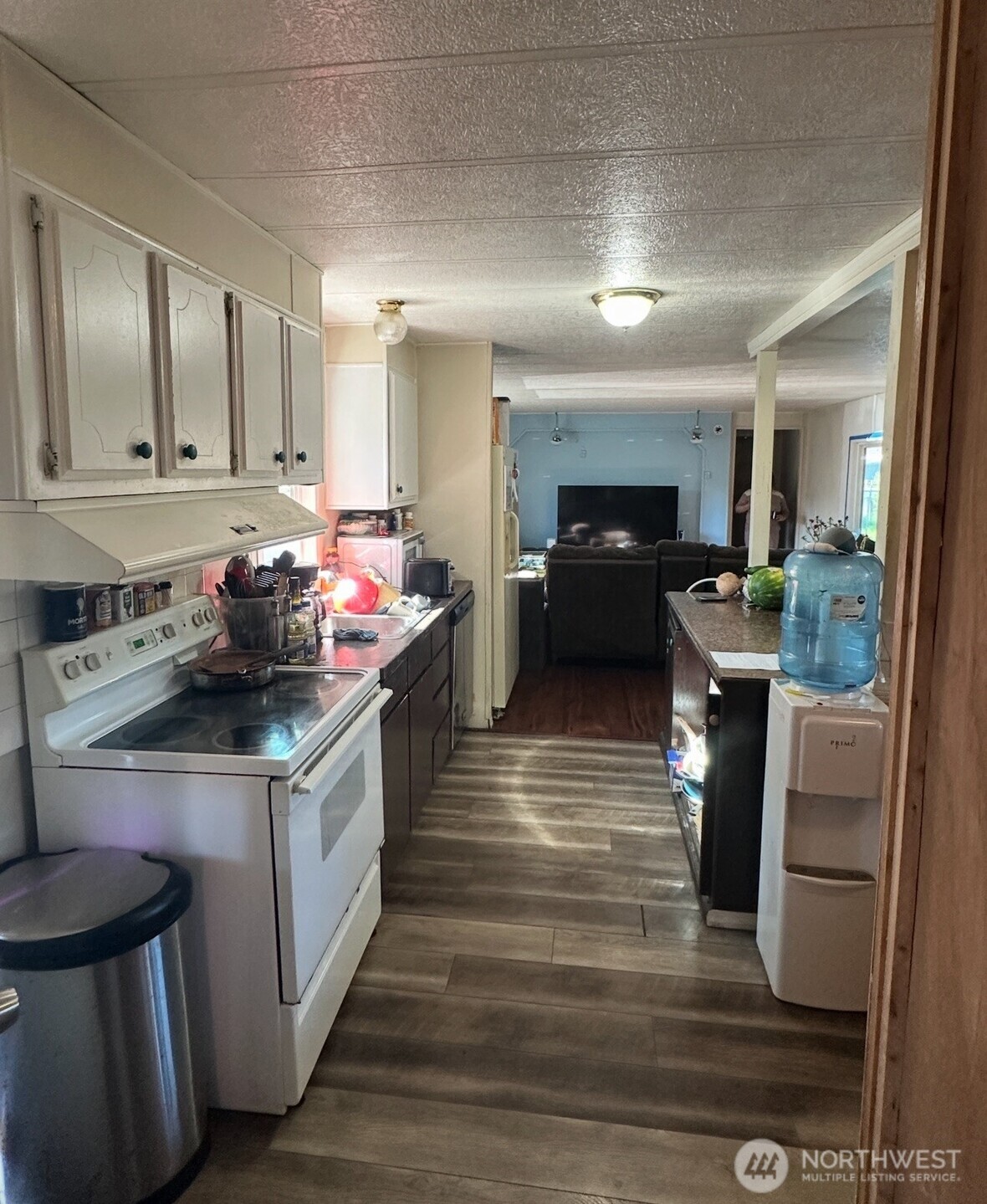 205 Reeds Lane, Unit 64 Everson, WA 98247 - Photo 5 of 9 a kitchen with granite countertop a sink stove and cabinets