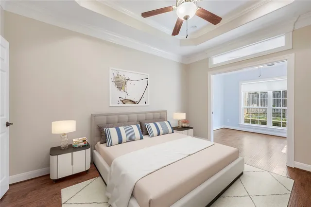 a bedroom with a large bed and a large window