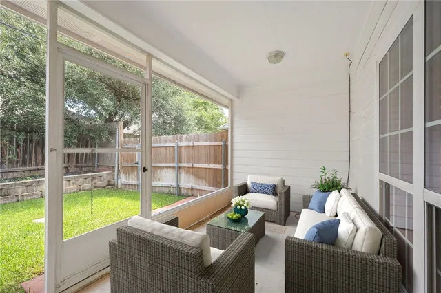 a living room with furniture and a garden