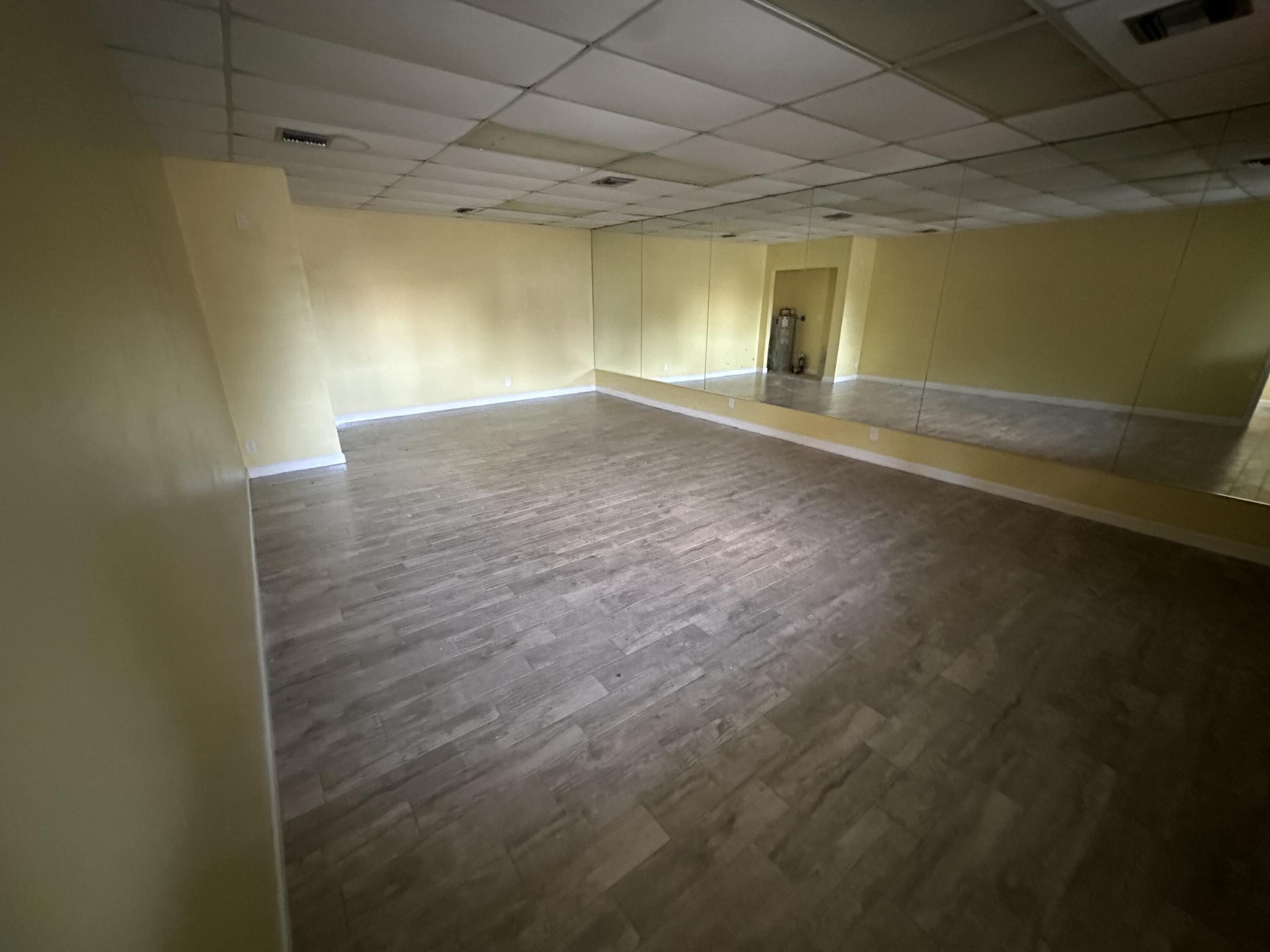 705 Park Avenue, Unit A Lake Park, FL 33403 - Photo 12 of 28 a view of empty room with wooden floor