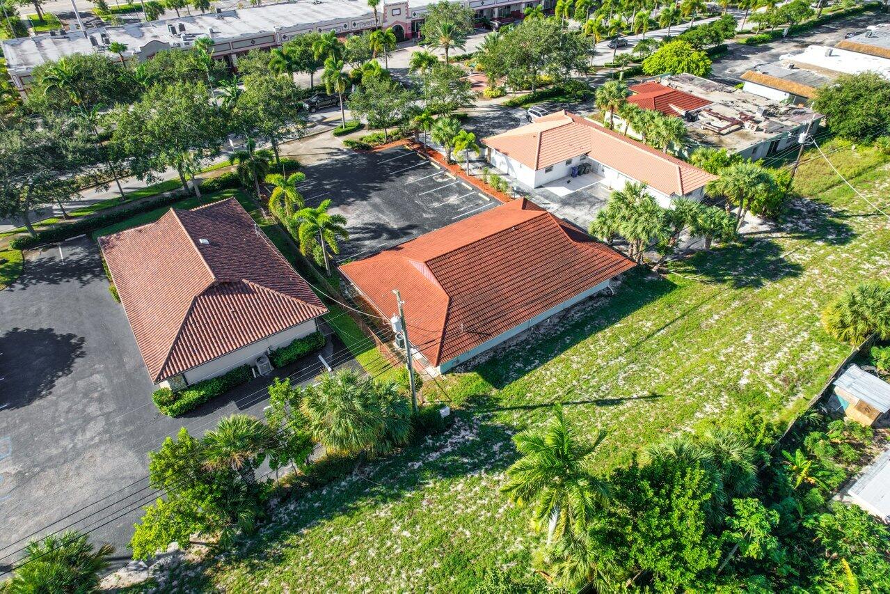 705 Park Avenue, Unit A Lake Park, FL 33403 - Photo 22 of 28 an aerial view of a house with garden space and street view