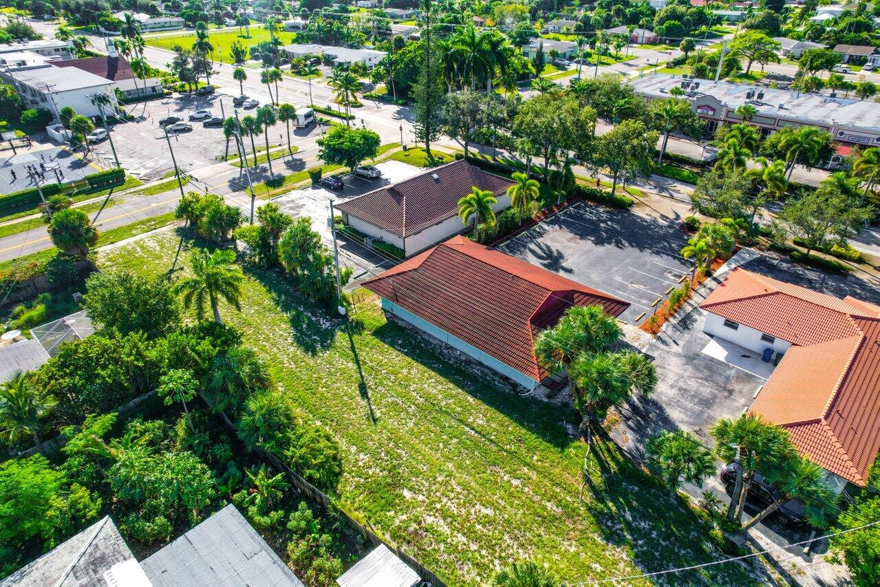 705 Park Avenue, Unit A Lake Park, FL 33403 - Photo 24 of 28 an aerial view of residential houses with outdoor space and swimming pool