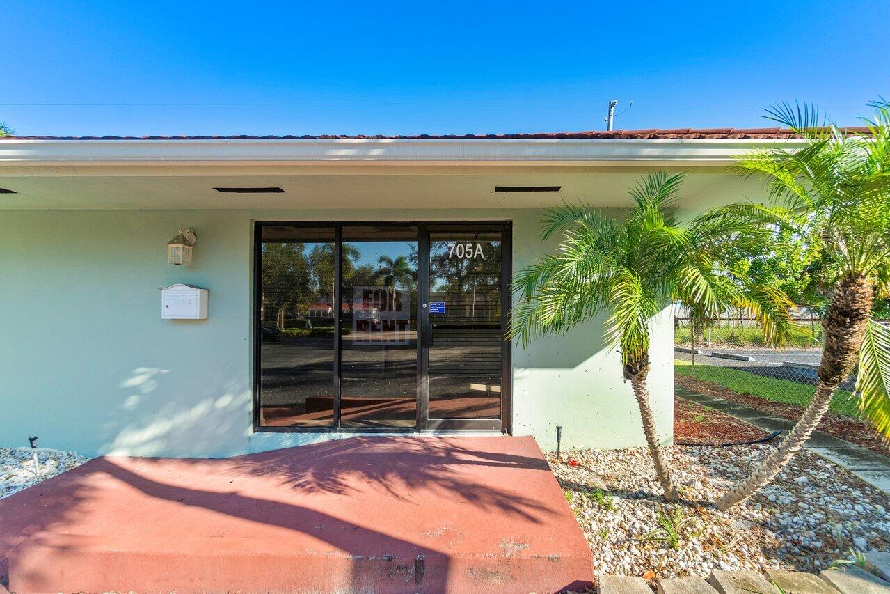 705 Park Avenue, Unit A Lake Park, FL 33403 - Photo 4 of 28 a house view with a outdoor space