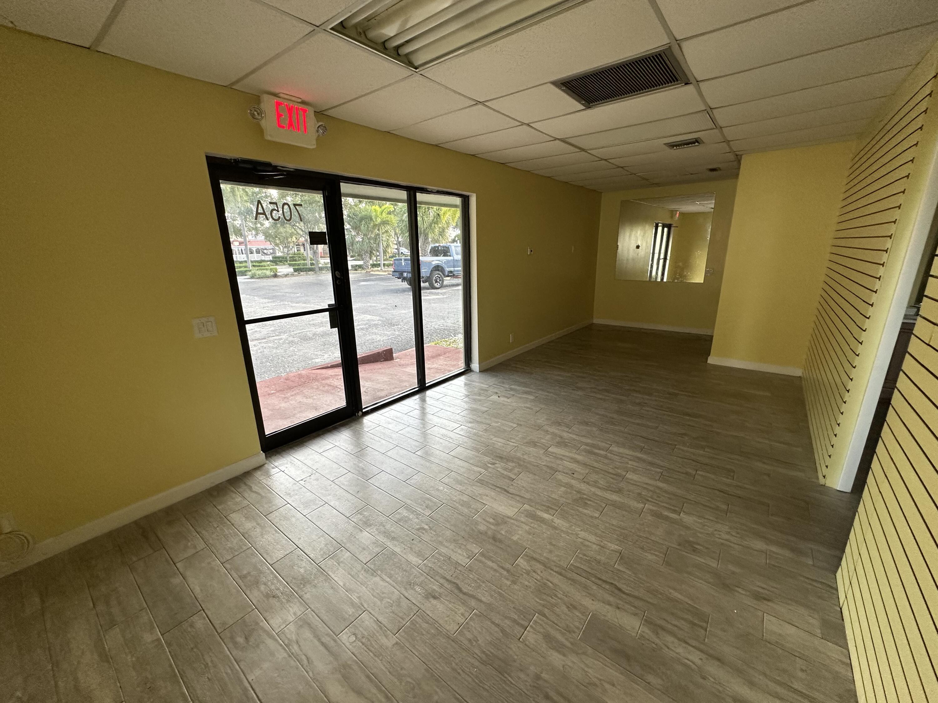 705 Park Avenue, Unit A Lake Park, FL 33403 - Photo 7 of 28 a view of an empty room with a window