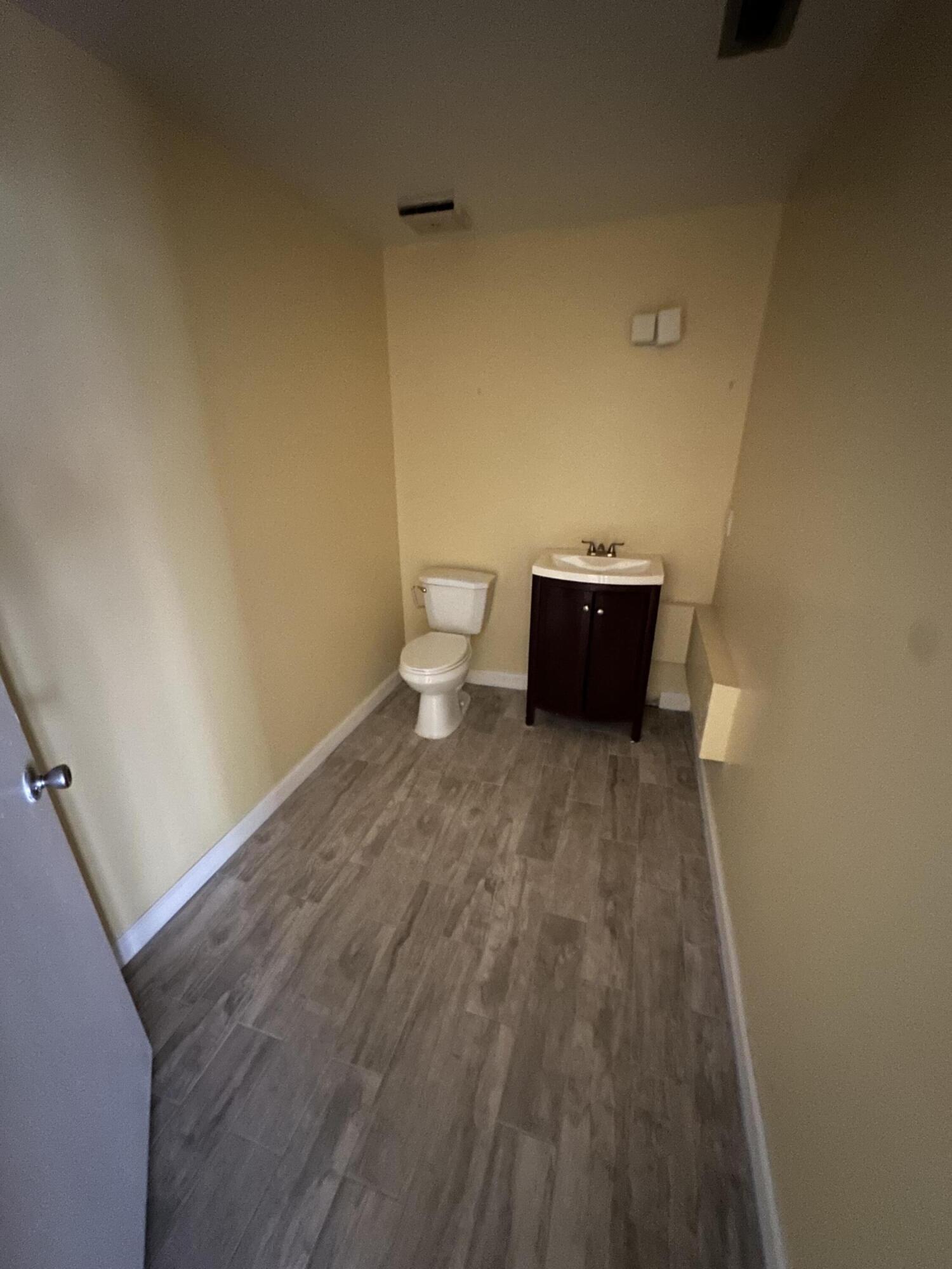 705 Park Avenue, Unit A Lake Park, FL 33403 - Photo 9 of 28 a view of room with wooden floor