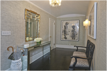 a hallway with furniture and wooden floor