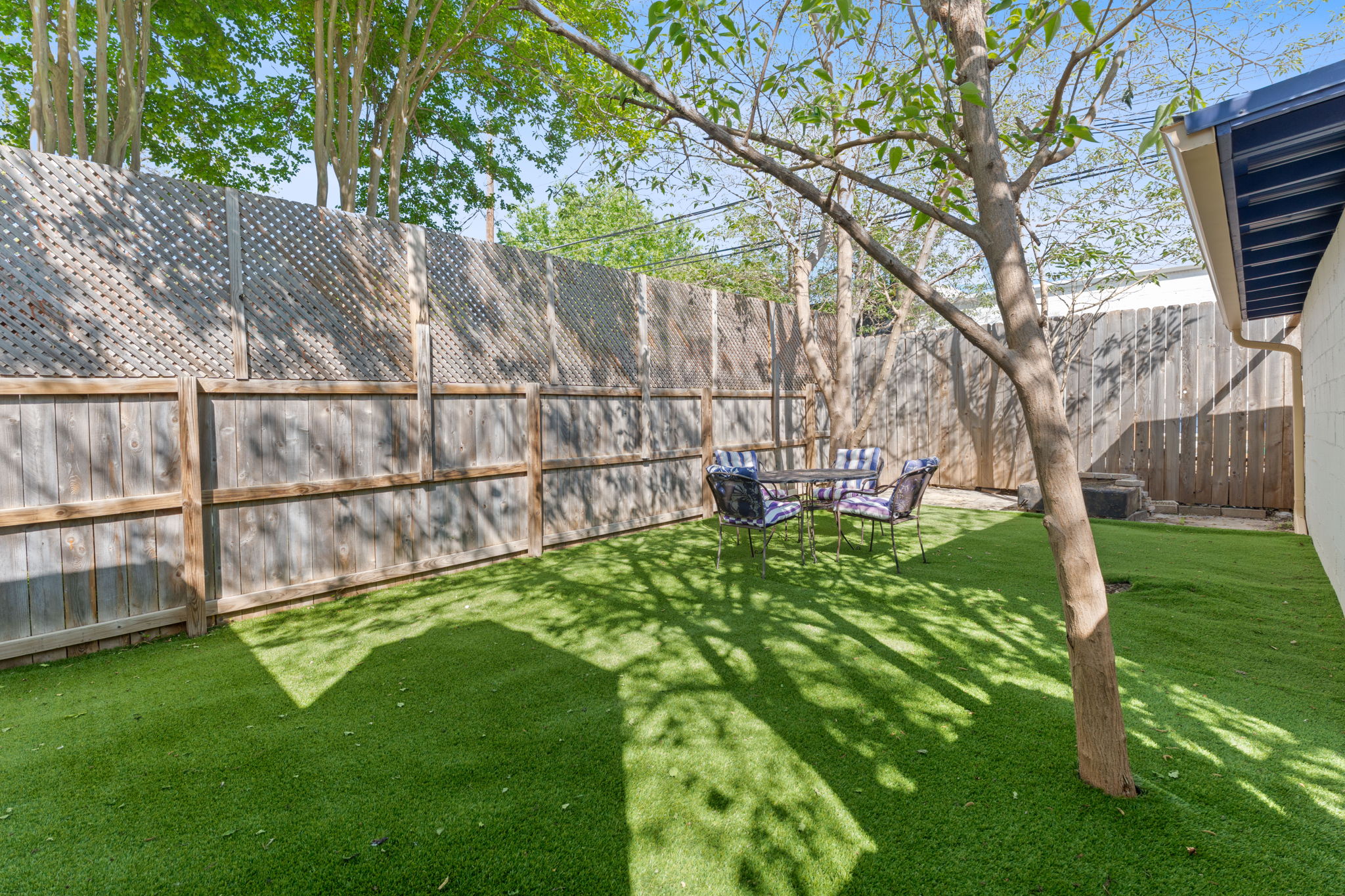 4611 Rosedale Avenue Austin, TX 78756 - Photo 27 of 35 The back unit's own separate fenced turf yard is ideal for pets and easy entertaining, adding a private outdoor dimension that renters and owner-occupants will love.