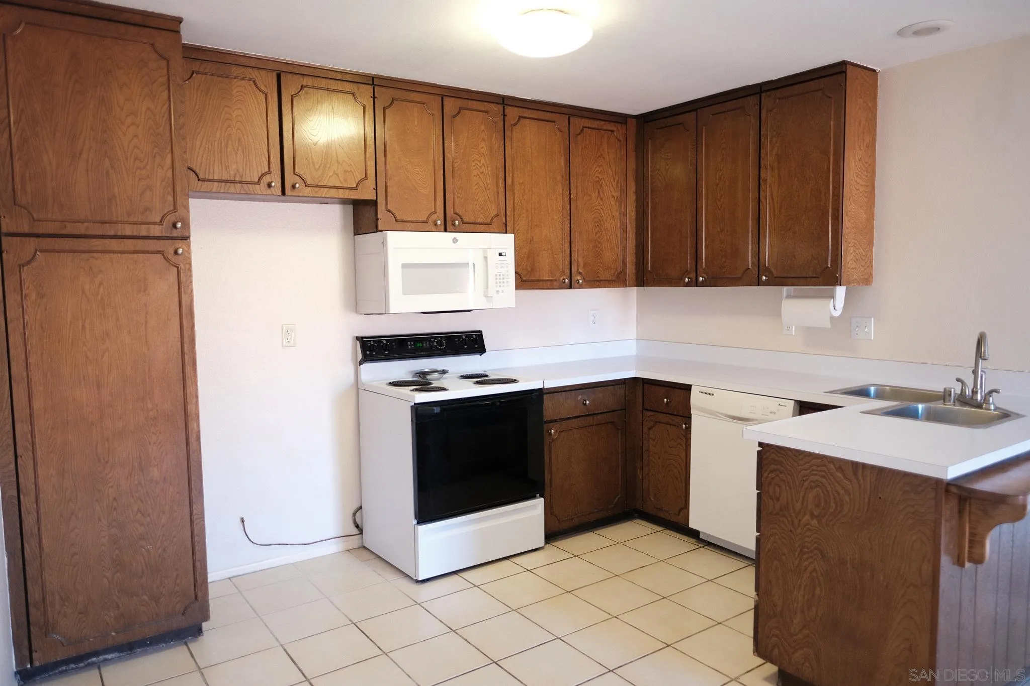 2142 Ridgeview Place Escondido, CA 92026 - Photo 7 of 29 a kitchen with a cabinets and steel appliances