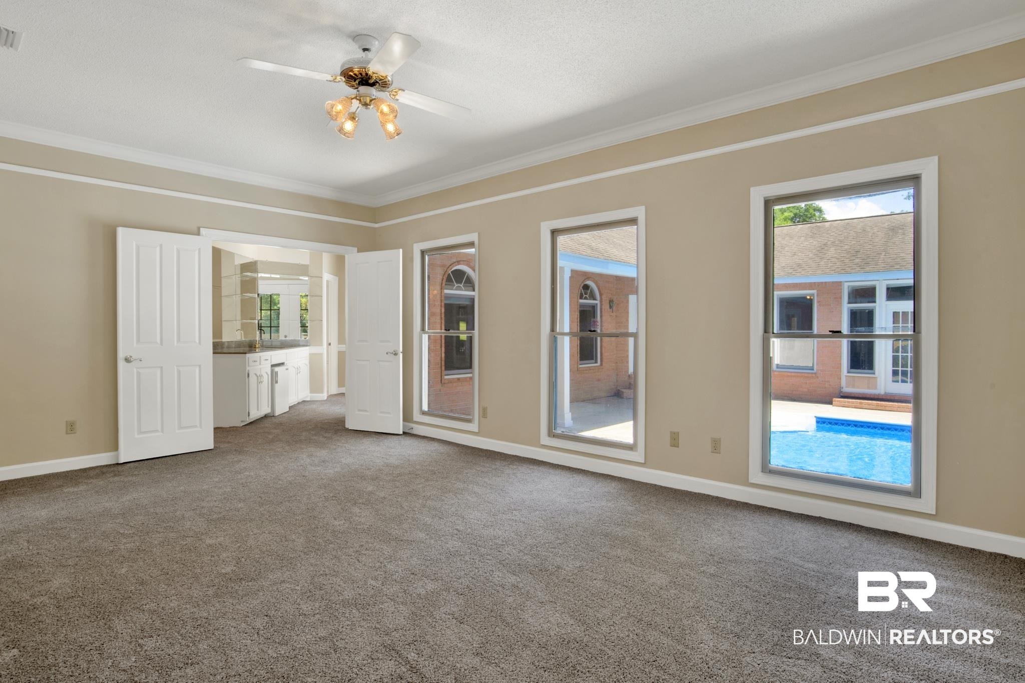 6805 Hunters Court Mobile, AL 36695 - Photo 18 of 37 Empty room with ornamental molding, carpet floors, ceiling fan, and baseboards
