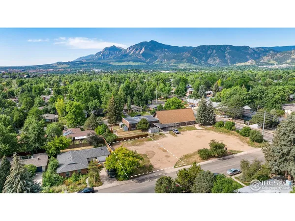 a view of a patio with a table and chairs