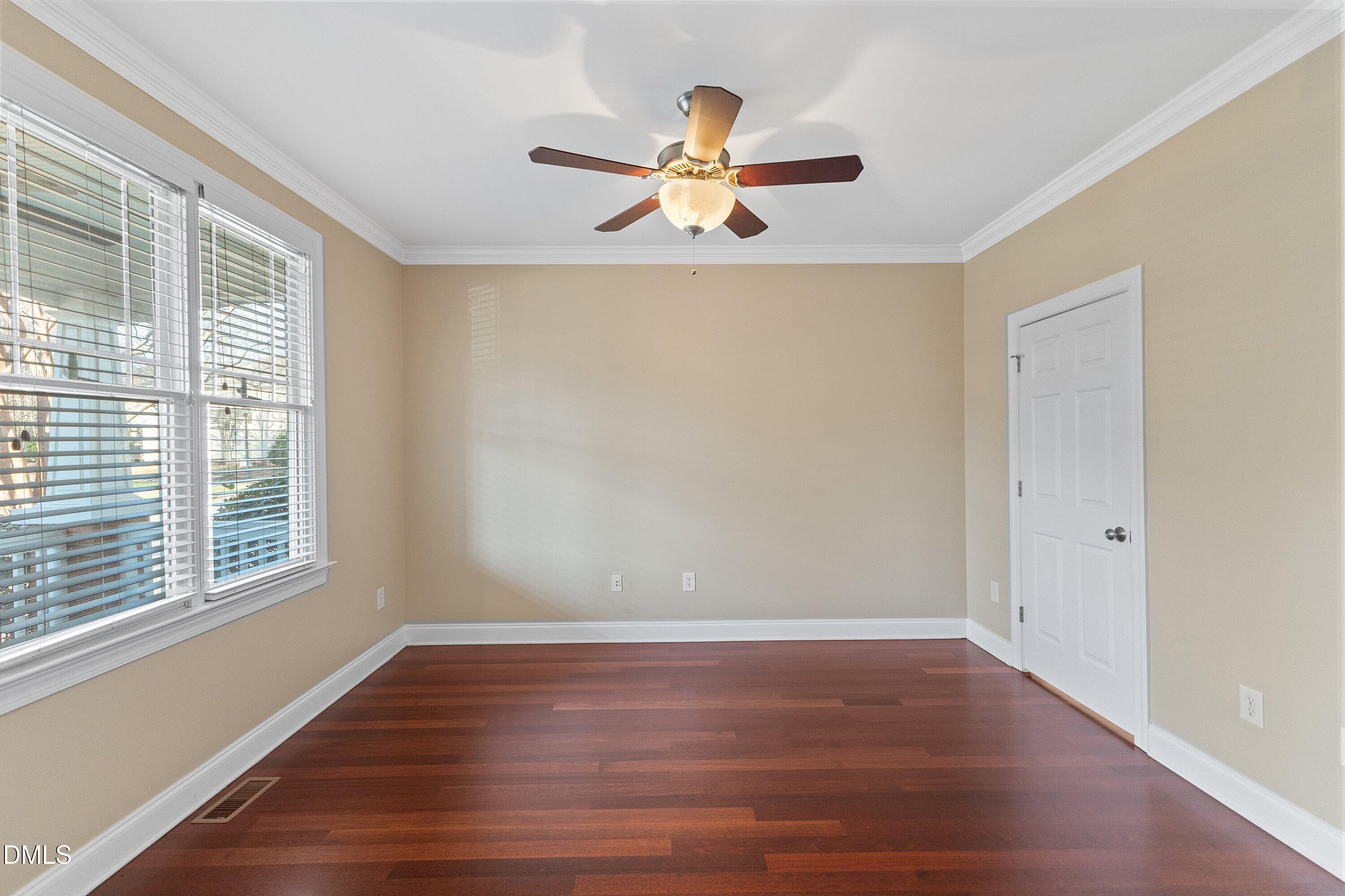 2124 Karns Place Raleigh, NC 27614 - Photo 9 of 74 a view of empty room with wooden floor and fan