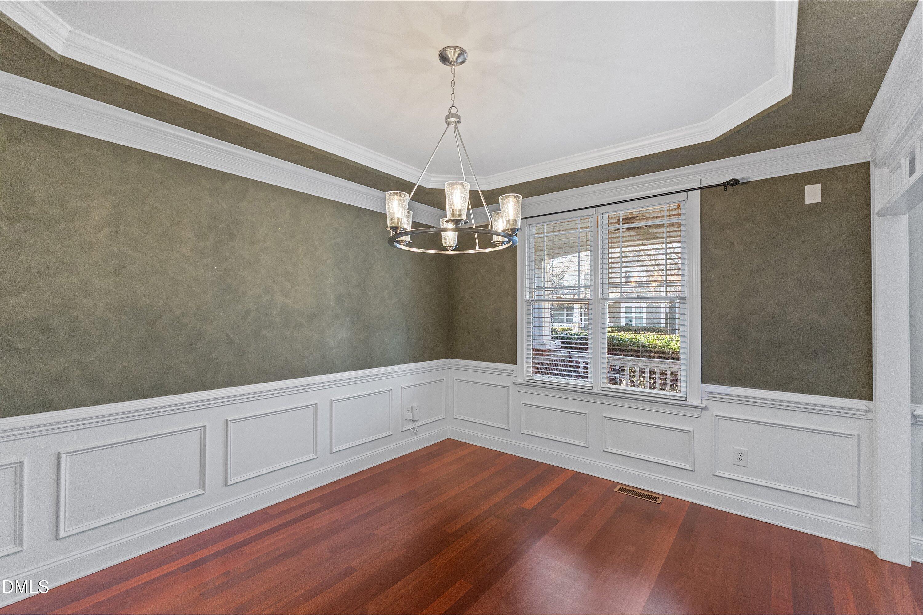 2124 Karns Place Raleigh, NC 27614 - Photo 14 of 74 a view of an empty room with wooden floor and a window