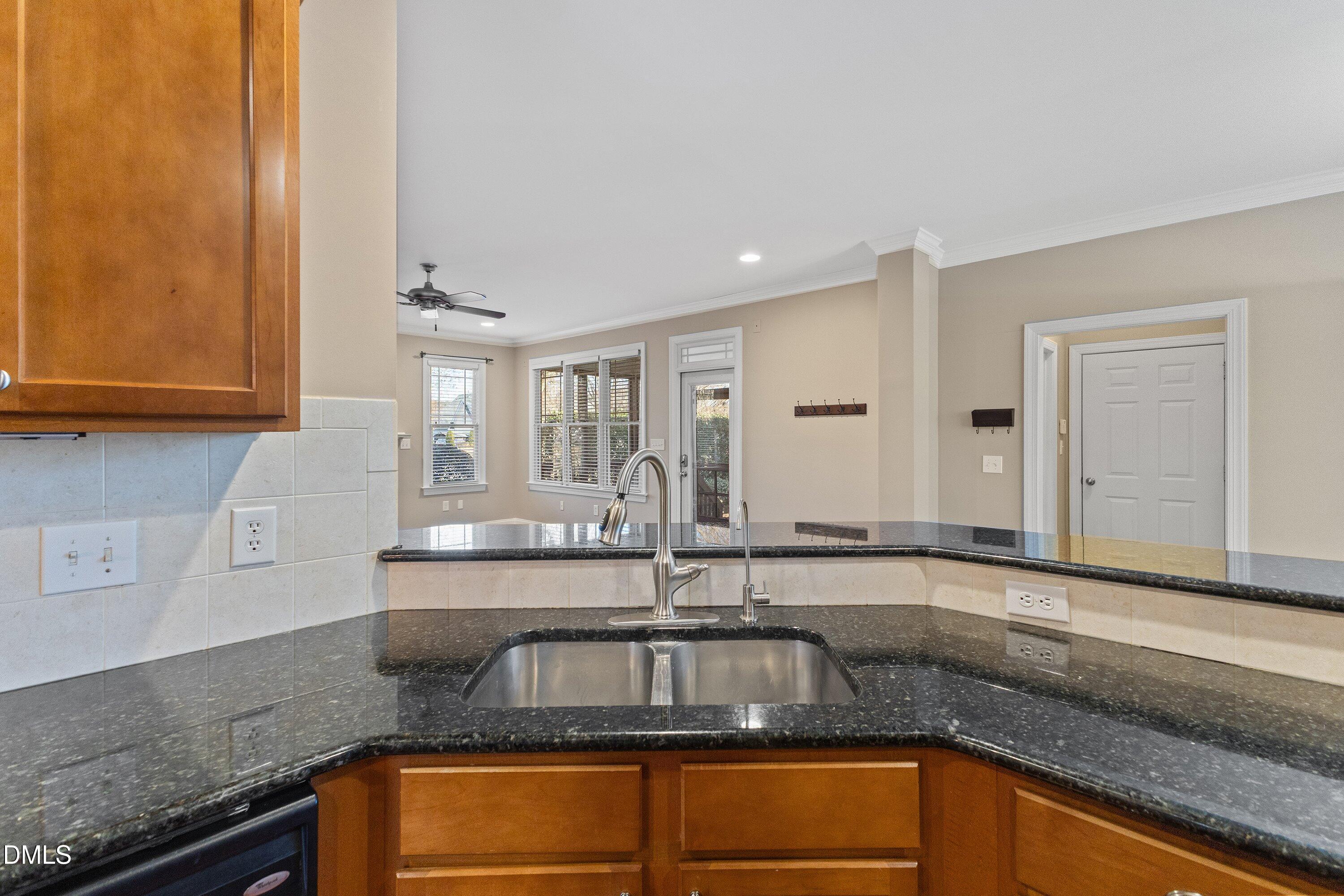 2124 Karns Place Raleigh, NC 27614 - Photo 16 of 74 a kitchen with granite countertop a sink and a stove
