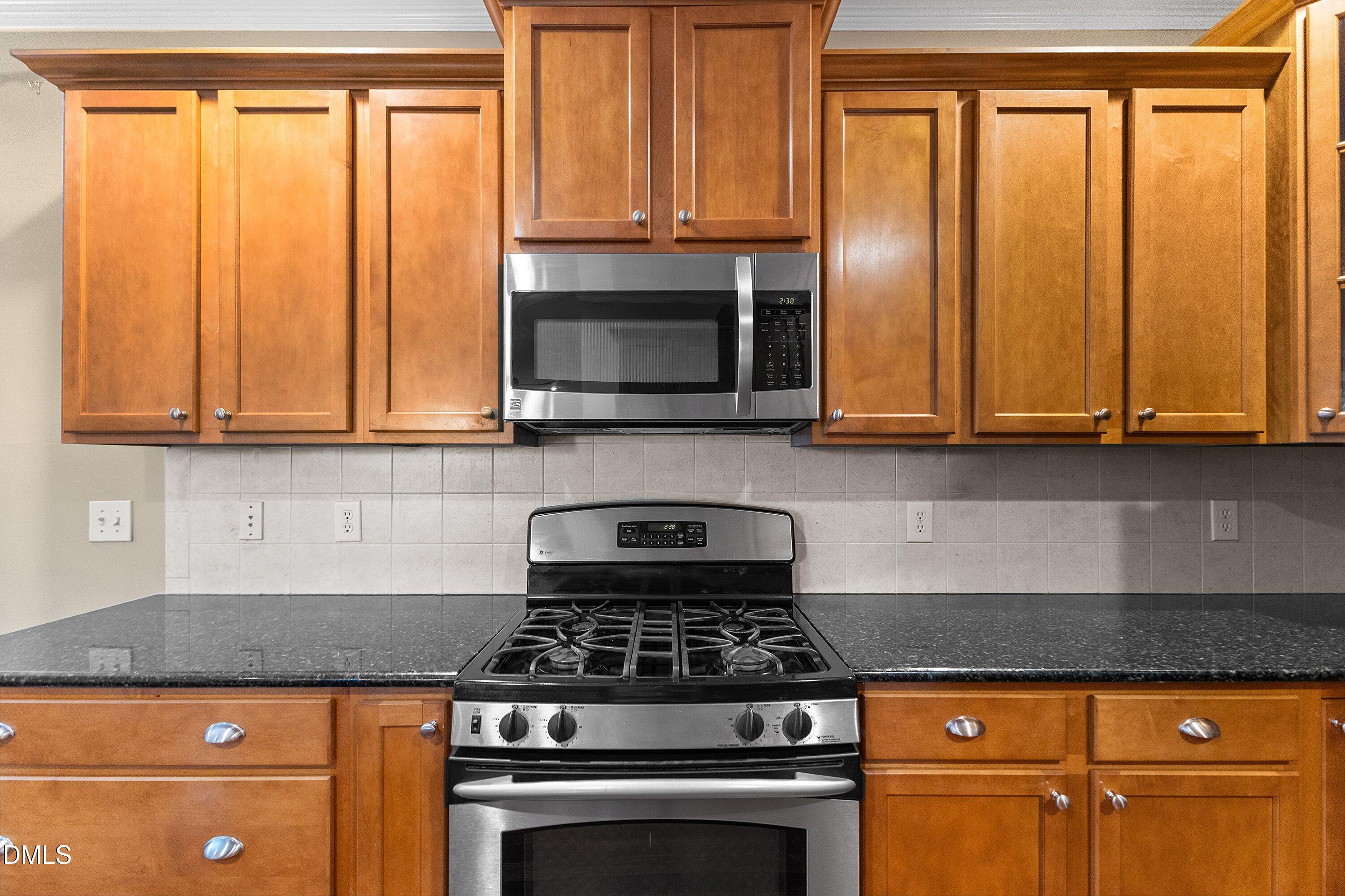 2124 Karns Place Raleigh, NC 27614 - Photo 17 of 74 a kitchen with granite countertop cabinets stainless steel appliances and a counter space