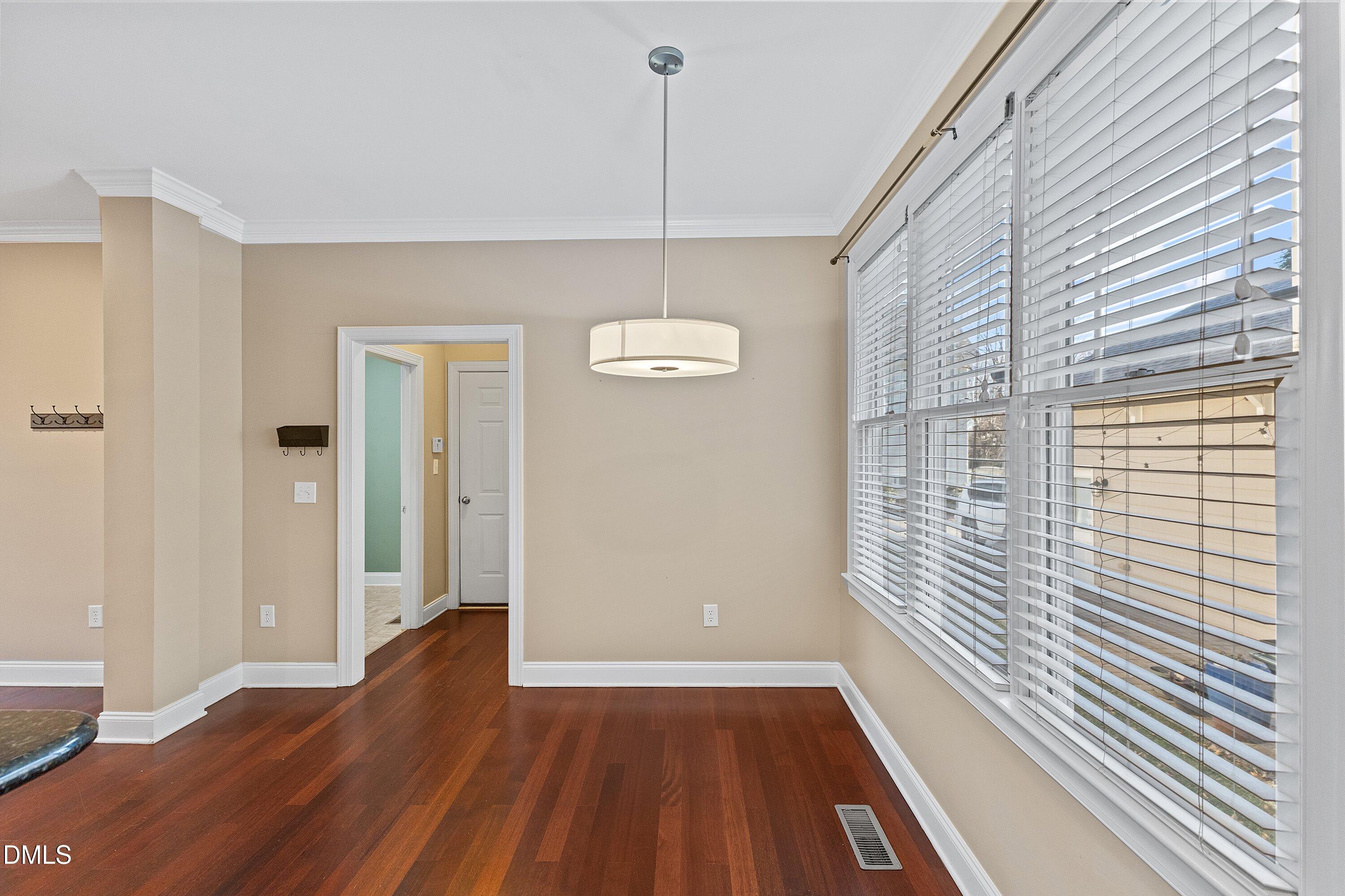 2124 Karns Place Raleigh, NC 27614 - Photo 20 of 74 a view of a room with wooden floor and windows