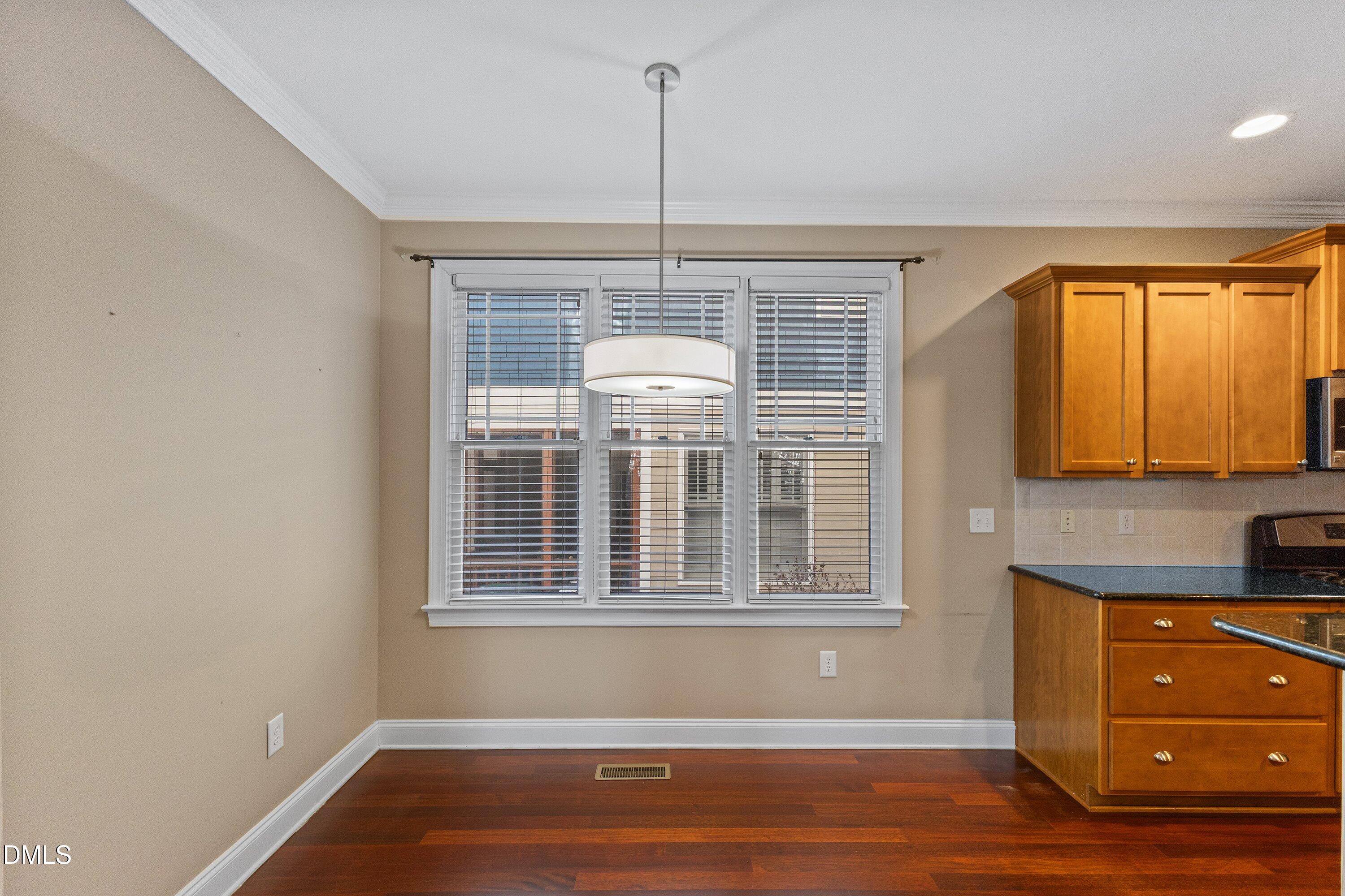 2124 Karns Place Raleigh, NC 27614 - Photo 21 of 74 a view of a room with wooden floor and windows
