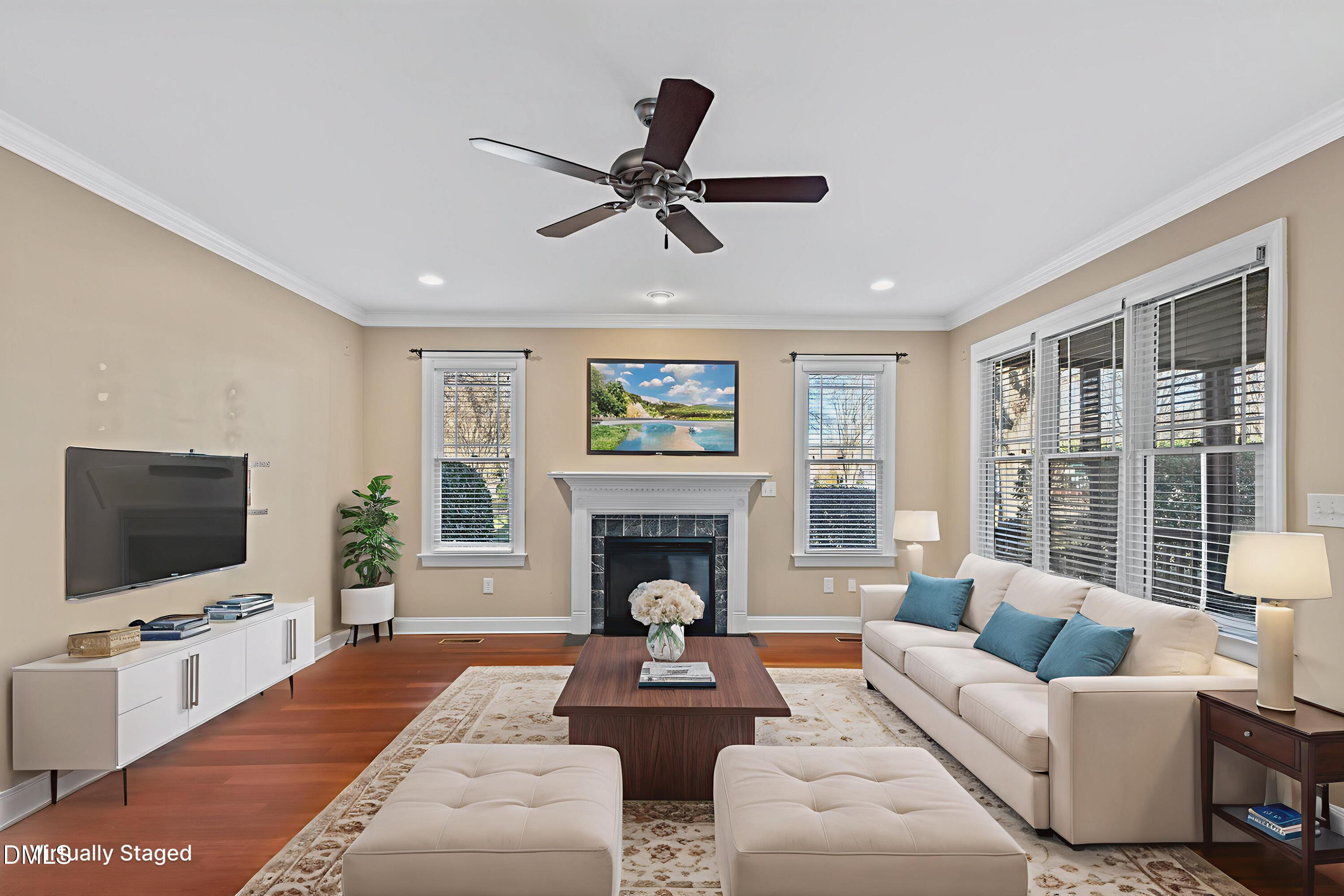 2124 Karns Place Raleigh, NC 27614 - Photo 23 of 74 a living room with furniture a fireplace and a flat screen tv