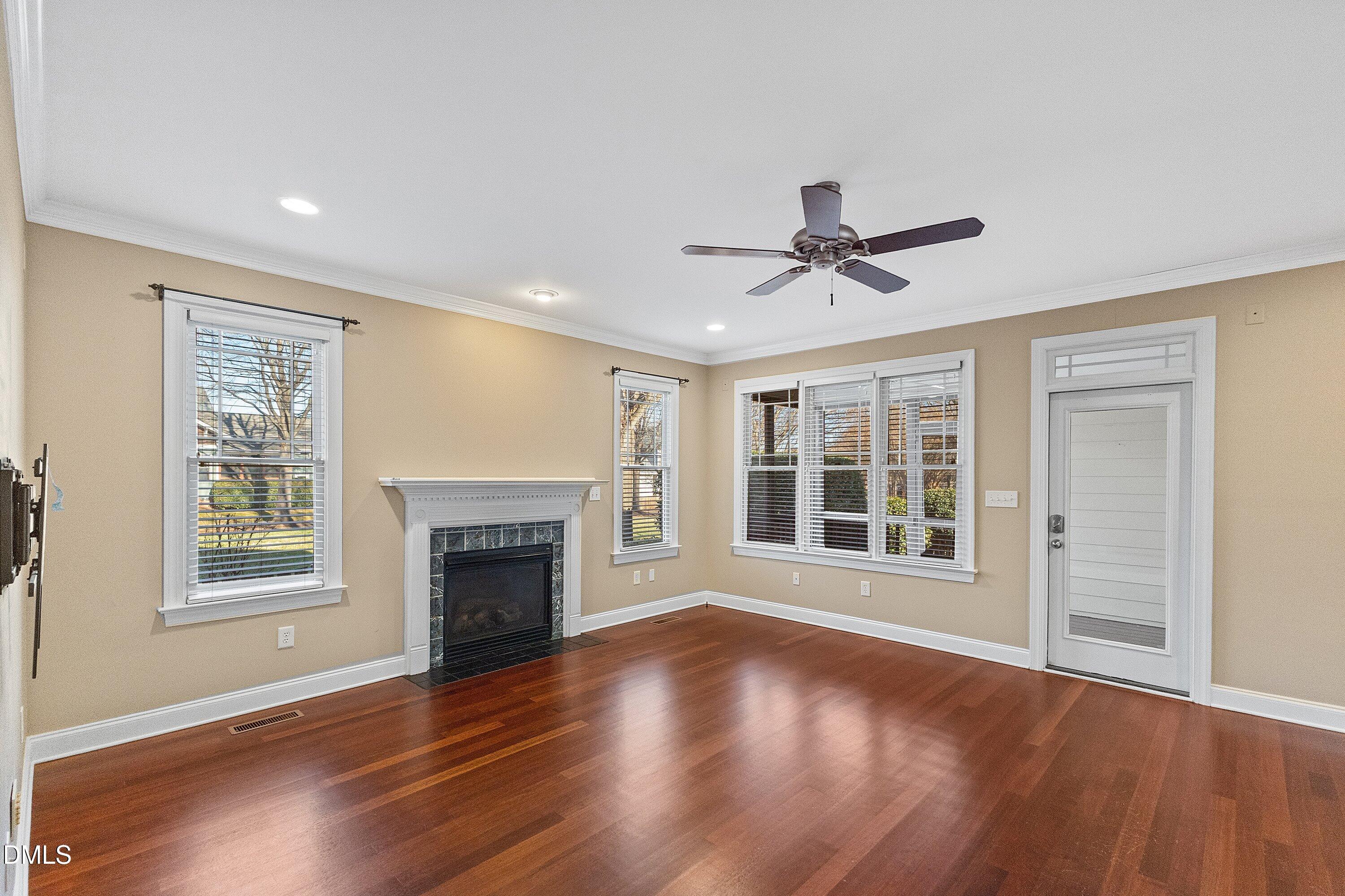 2124 Karns Place Raleigh, NC 27614 - Photo 26 of 74 a view of an empty room with wooden floor and a window