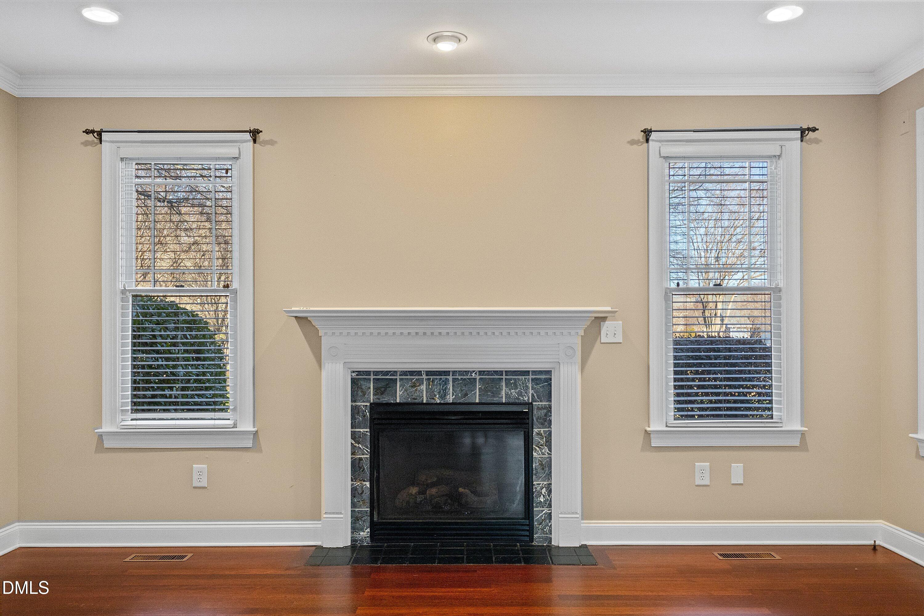 2124 Karns Place Raleigh, NC 27614 - Photo 27 of 74 a view of livingroom with a fireplace and wooden floor
