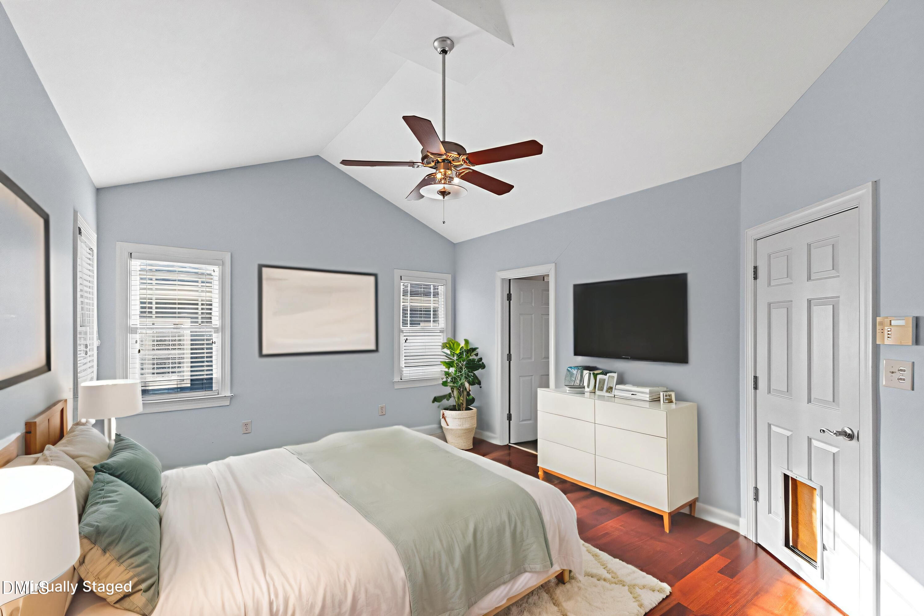 2124 Karns Place Raleigh, NC 27614 - Photo 34 of 74 a bedroom with a bed and a flat screen tv