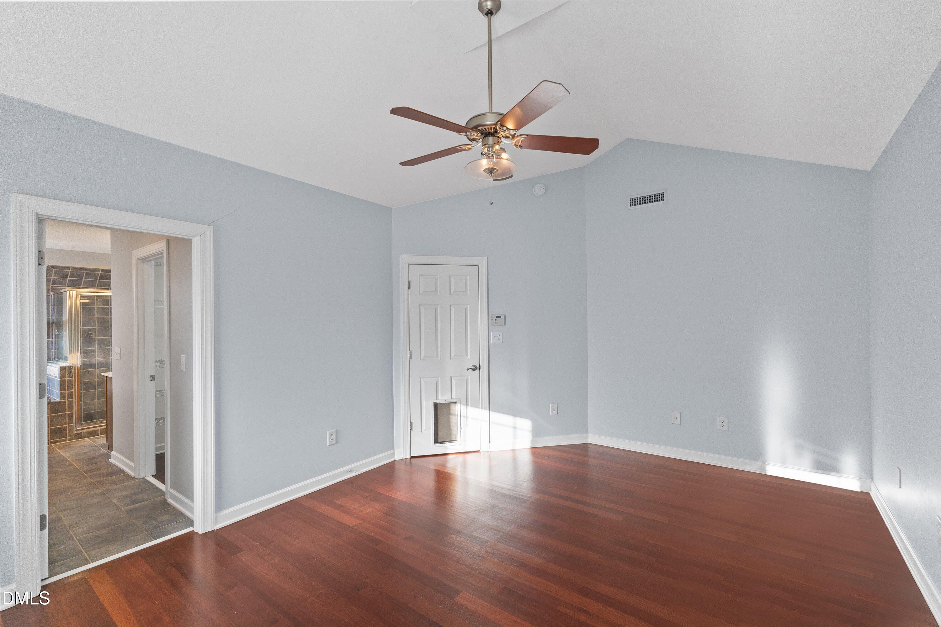 2124 Karns Place Raleigh, NC 27614 - Photo 37 of 74 a view of a room with wooden floor and a ceiling fan