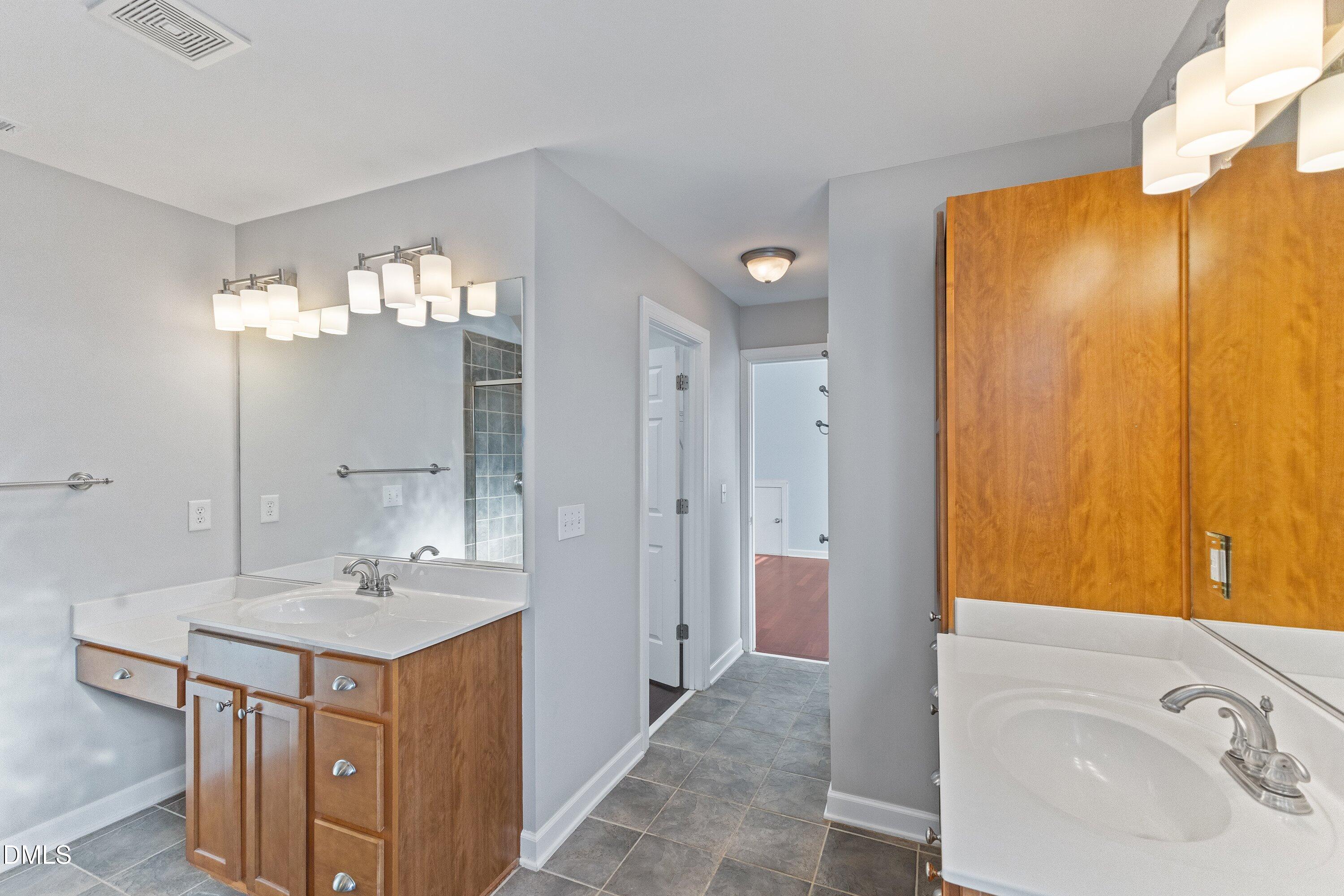 2124 Karns Place Raleigh, NC 27614 - Photo 41 of 74 a bathroom with a sink a toilet and shower
