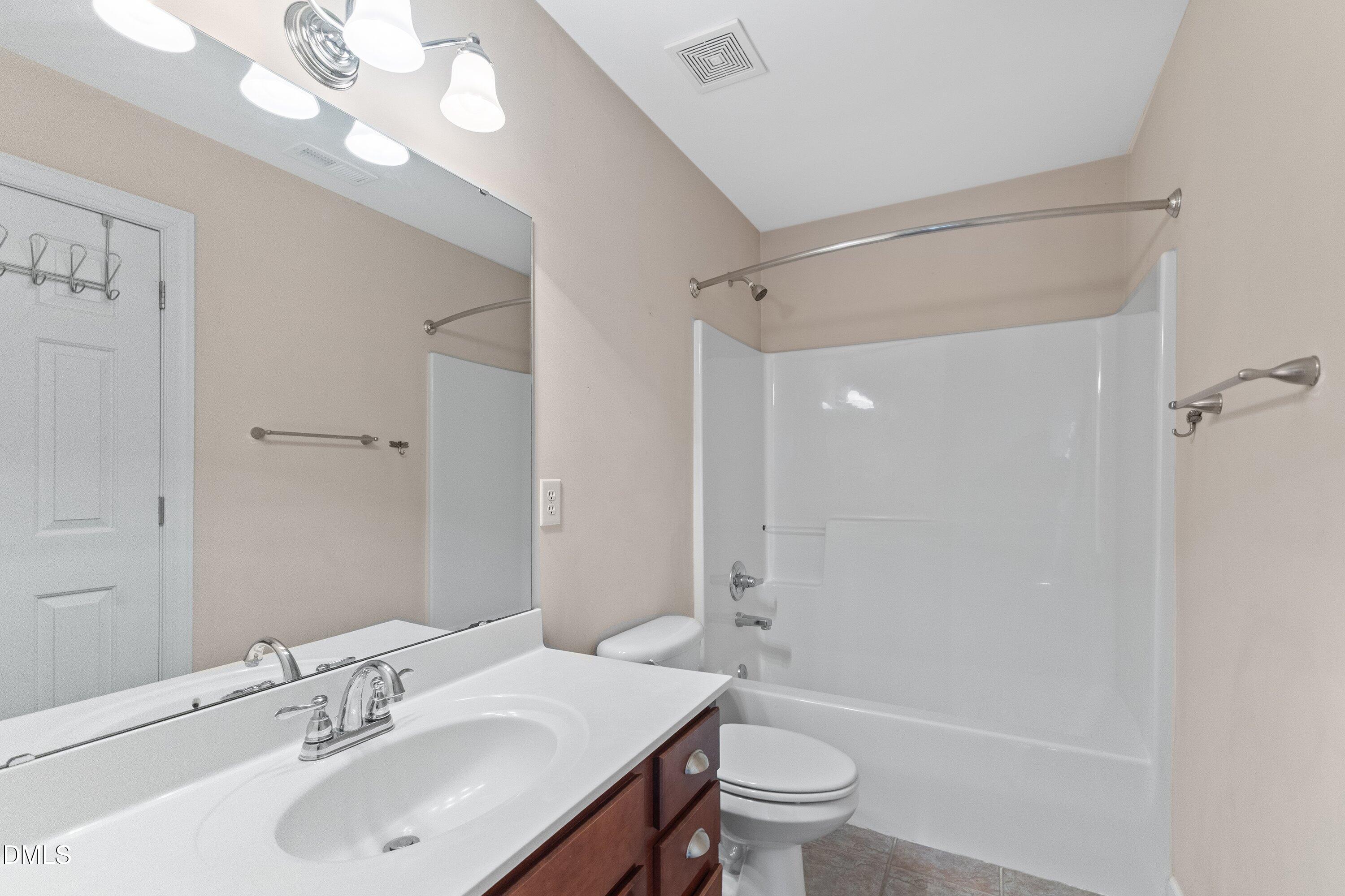 2124 Karns Place Raleigh, NC 27614 - Photo 46 of 74 a bathroom with a sink a toilet and shower