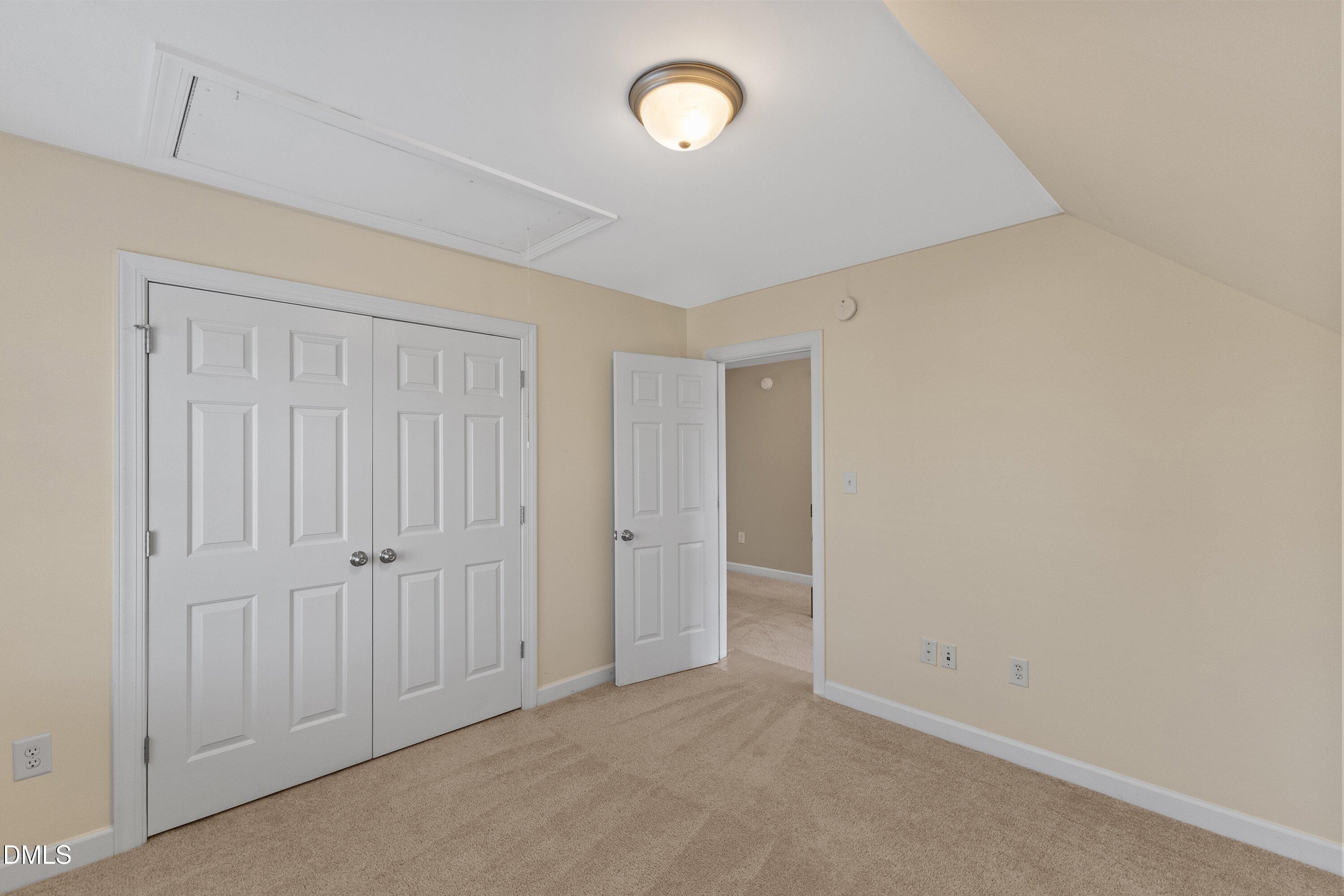 2124 Karns Place Raleigh, NC 27614 - Photo 48 of 74 an empty room with a fan & a mirror