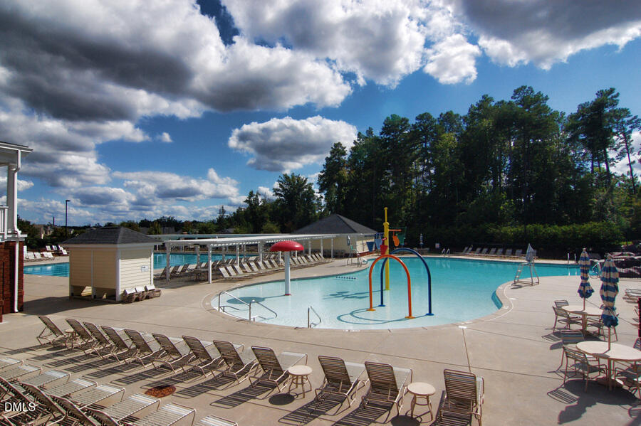 2124 Karns Place Raleigh, NC 27614 - Photo 68 of 74 a view of a swimming pool with a lounge chairs