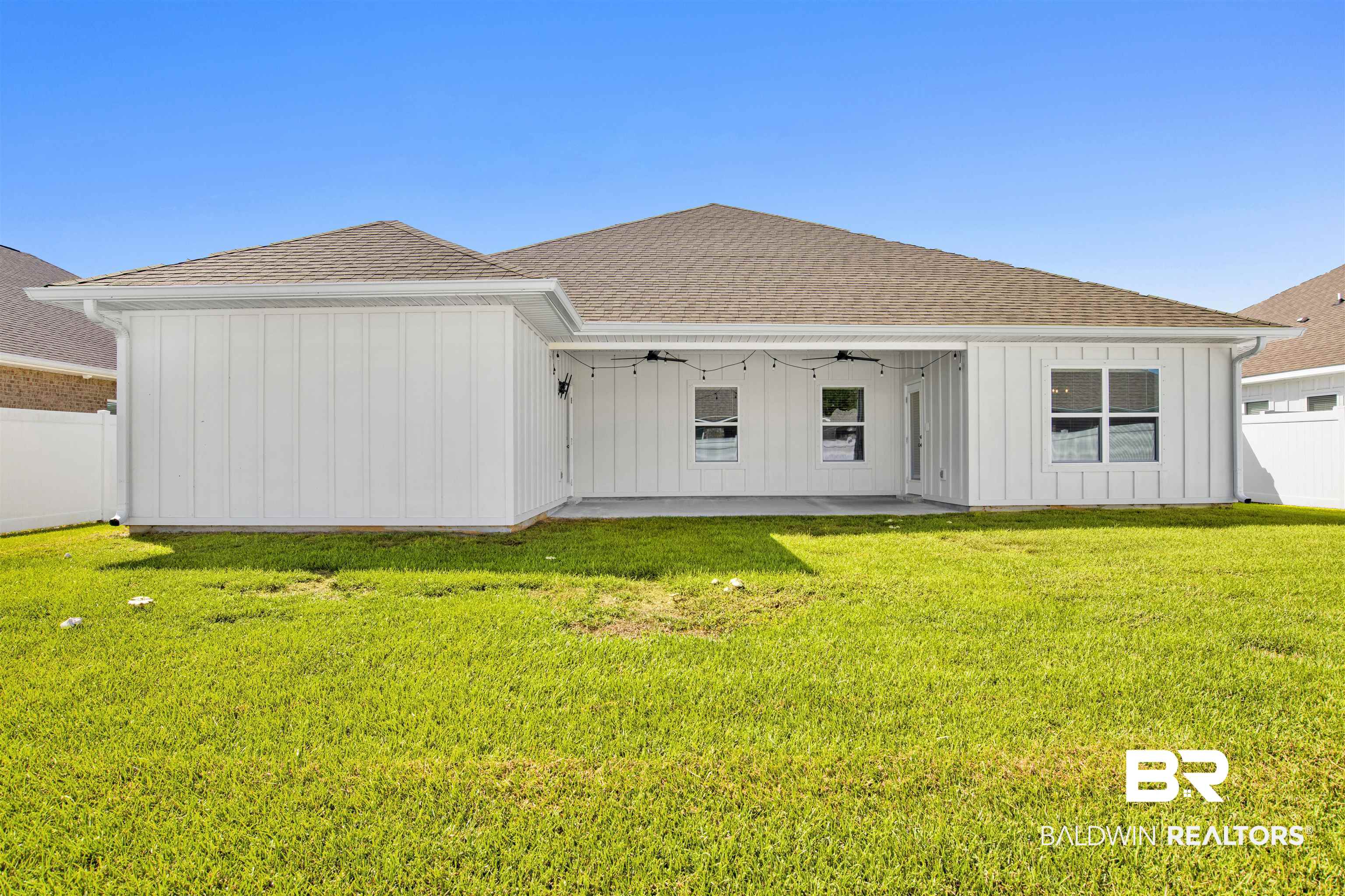 11602 Genuine Risk Circle Daphne, AL 36526 - Photo 27 of 30 Back of property featuring ceiling fan, a shingled roof, a fenced backyard, and board and batten siding