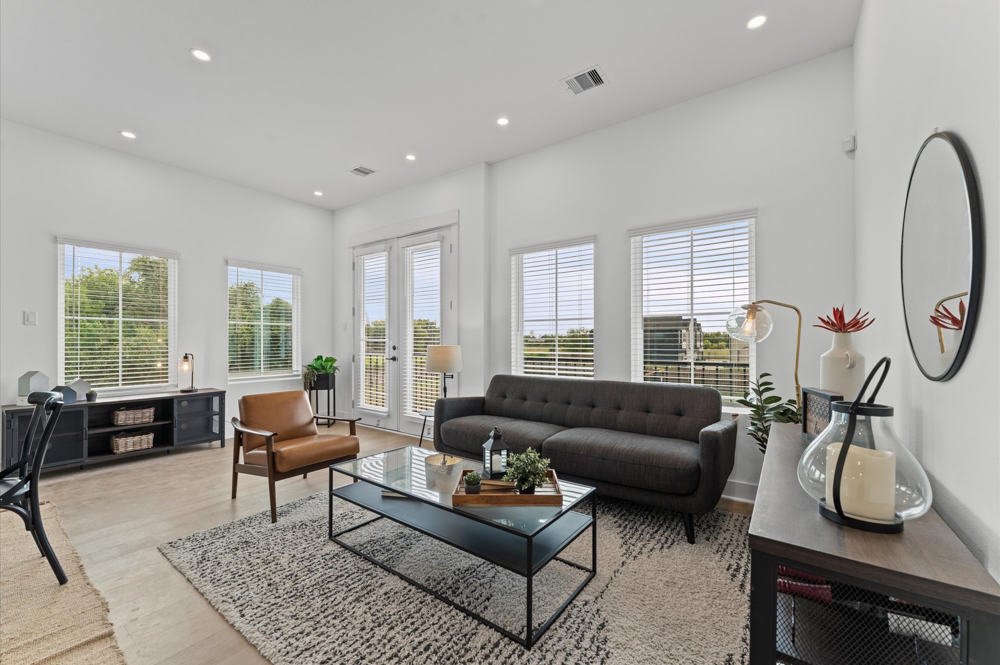 3002 Jensen Drive Houston, TX 77026 - Photo 10 of 42 a living room with furniture a table and large windows