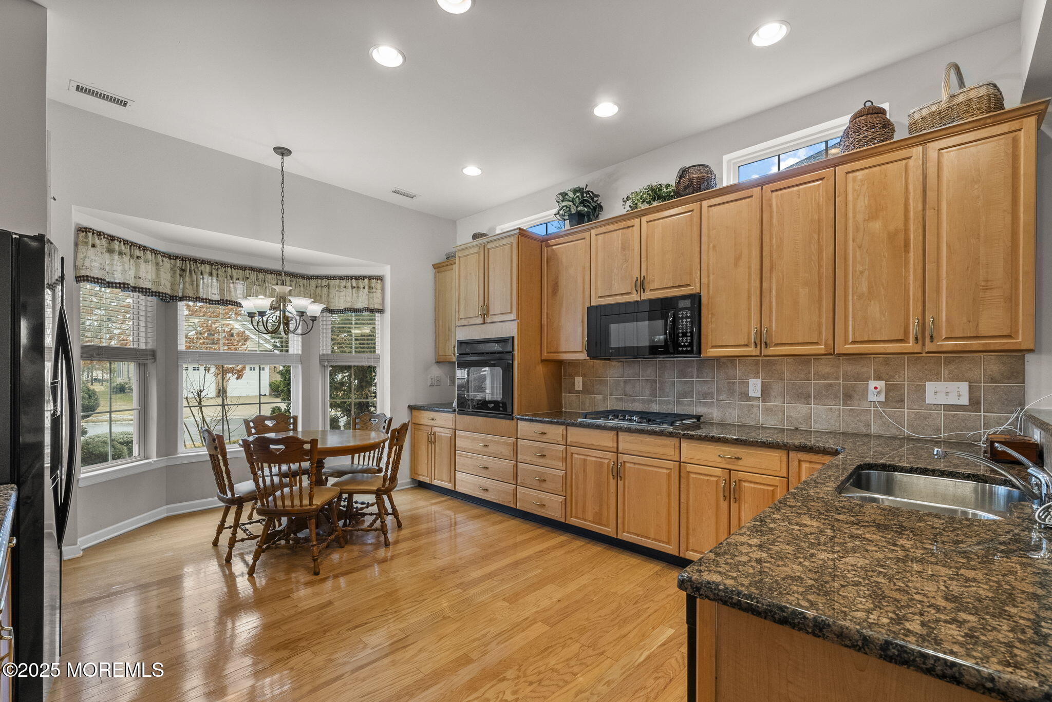14 Barton Creek Road Jackson, NJ 08527 - Photo 8 of 69 a kitchen with stainless steel appliances granite countertop sink microwave and wooden floor